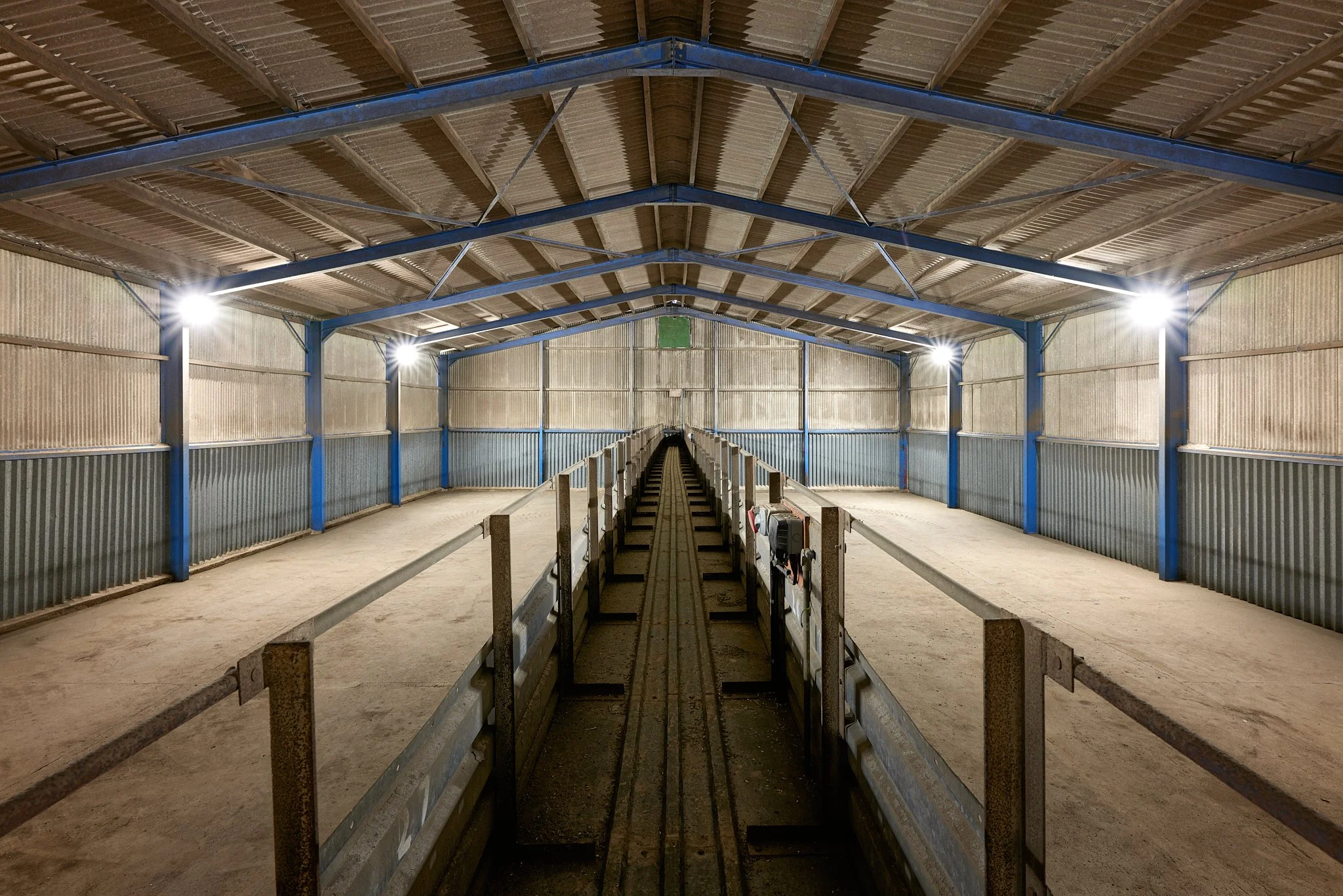 Internal photograph of a large agricultural or industrial storage unit.