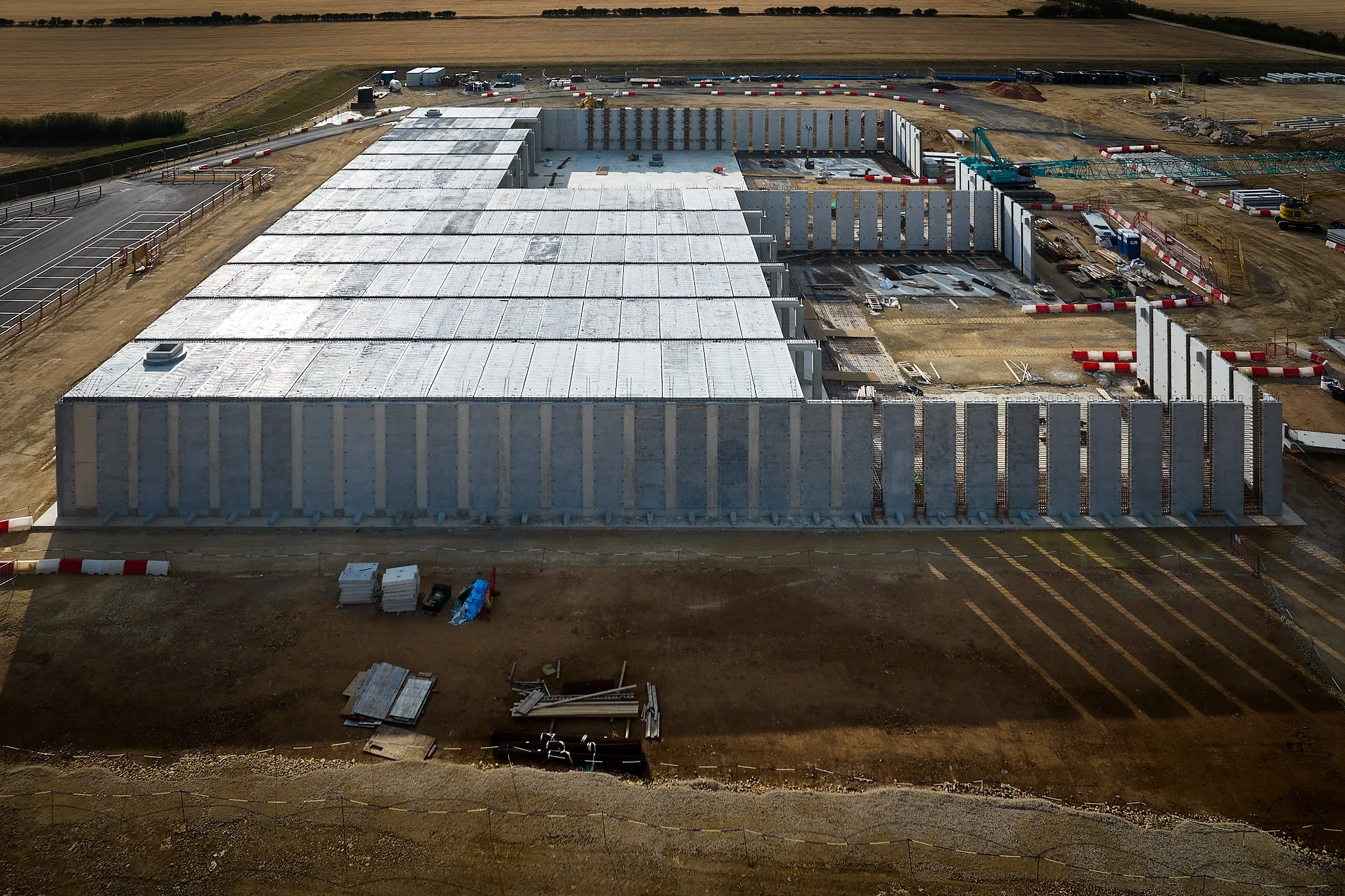 Aerial drone shot of above ground reservoir under construction.

