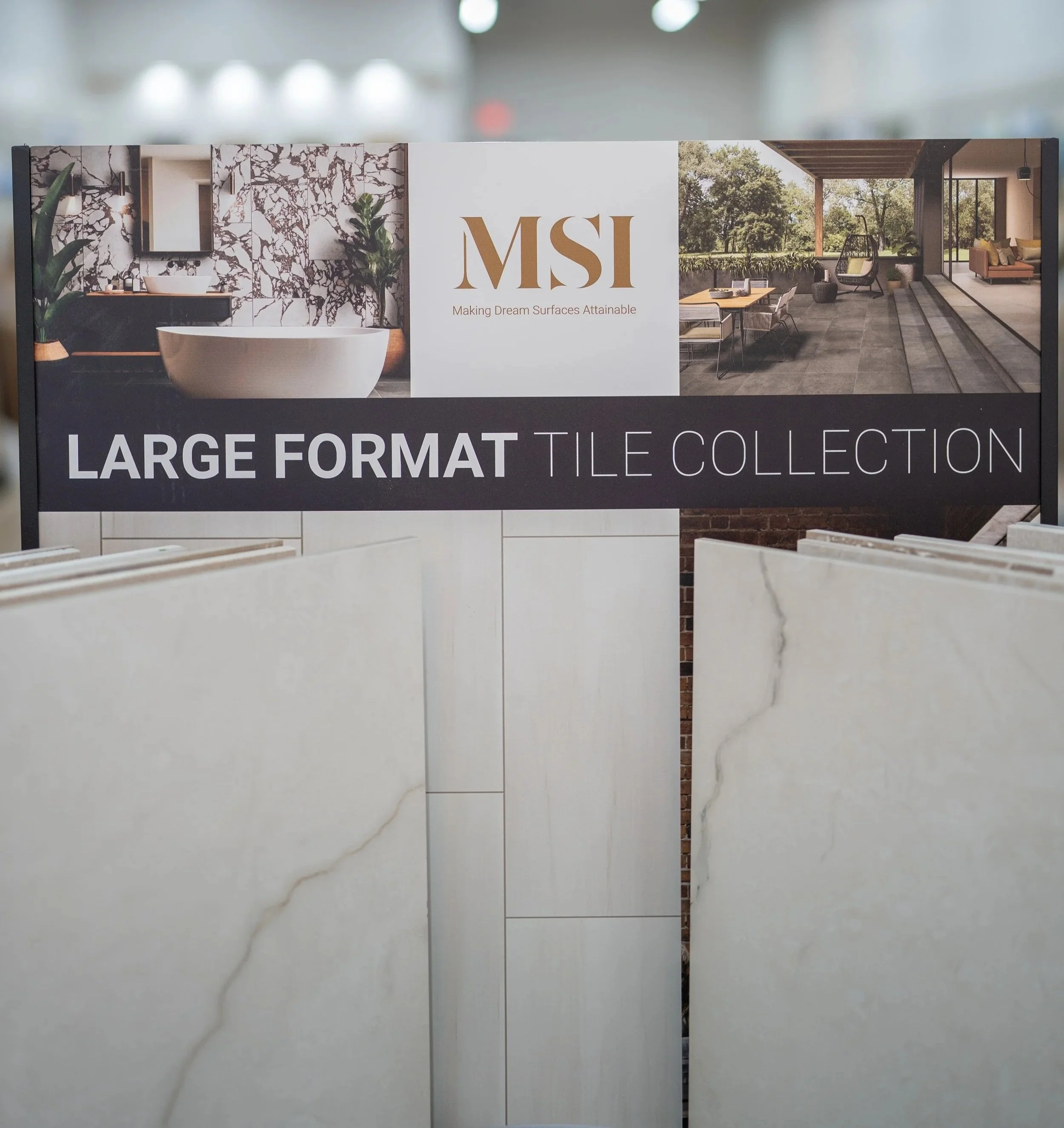 Sign advertising MSI large format tile collection at Seamless Floors showroom located in St Augustine