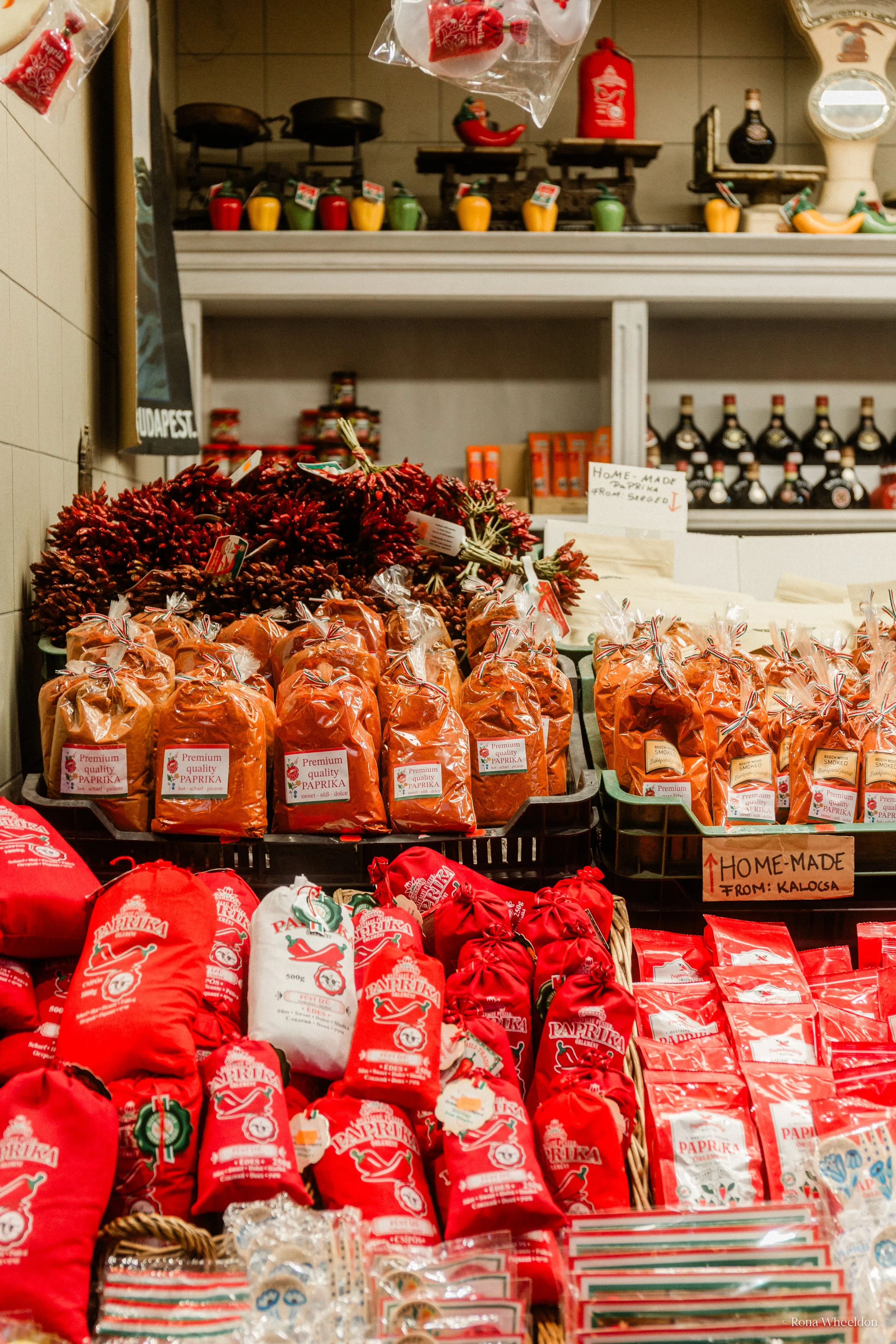Sweet, hot and smoked paprika displayed on a market stall