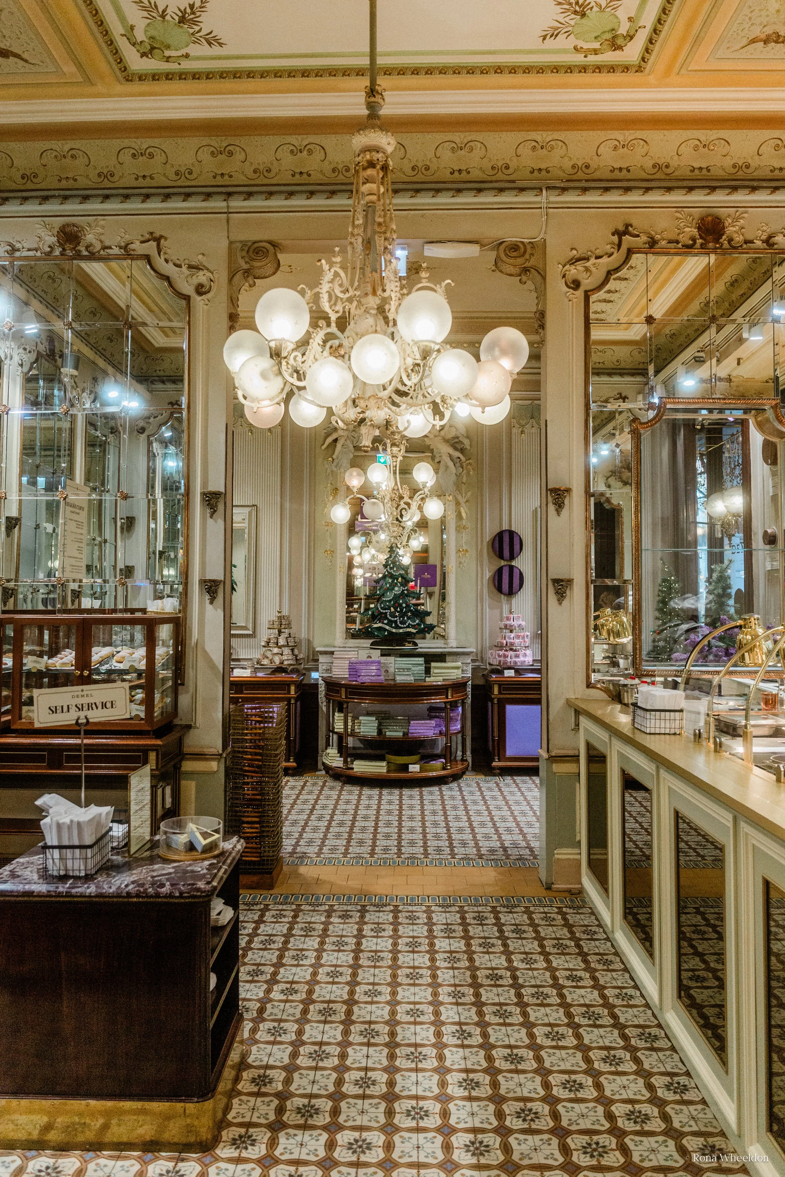 Elaborate chandeliers decorate the shop interior