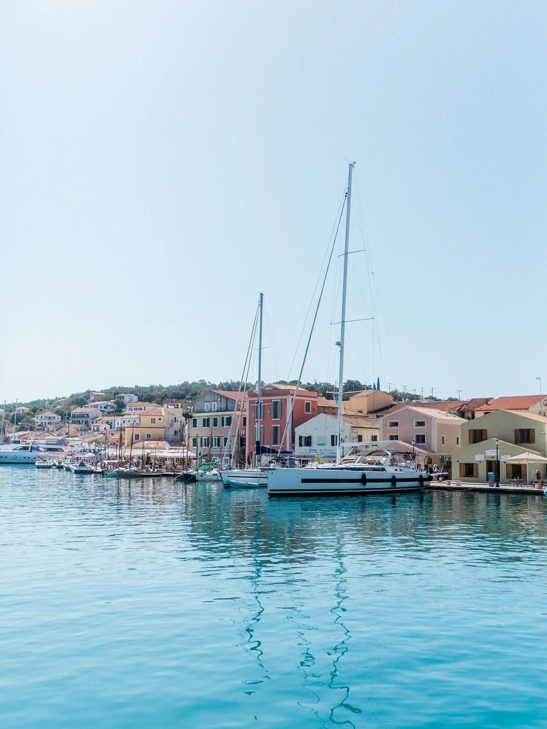 South of Corfu lies the Ionian island of Paxos and its charming capital, the harbour town of Gaios. 

The waterfront is alive with caf&eacute;s, tavernas and little boutiques, their terraces spilling out towards the harbour wall. 

Behind them, a maz