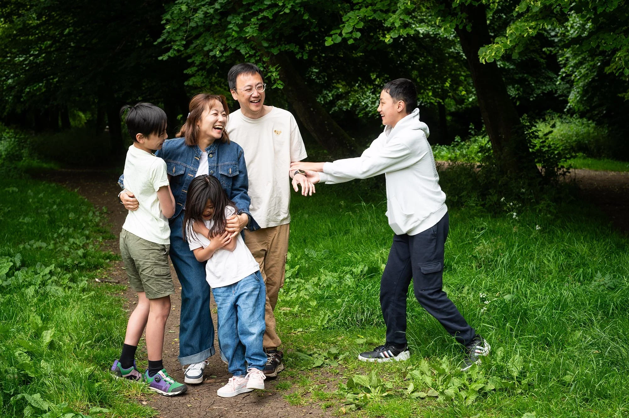Family laughing during photoshoot in Corsham