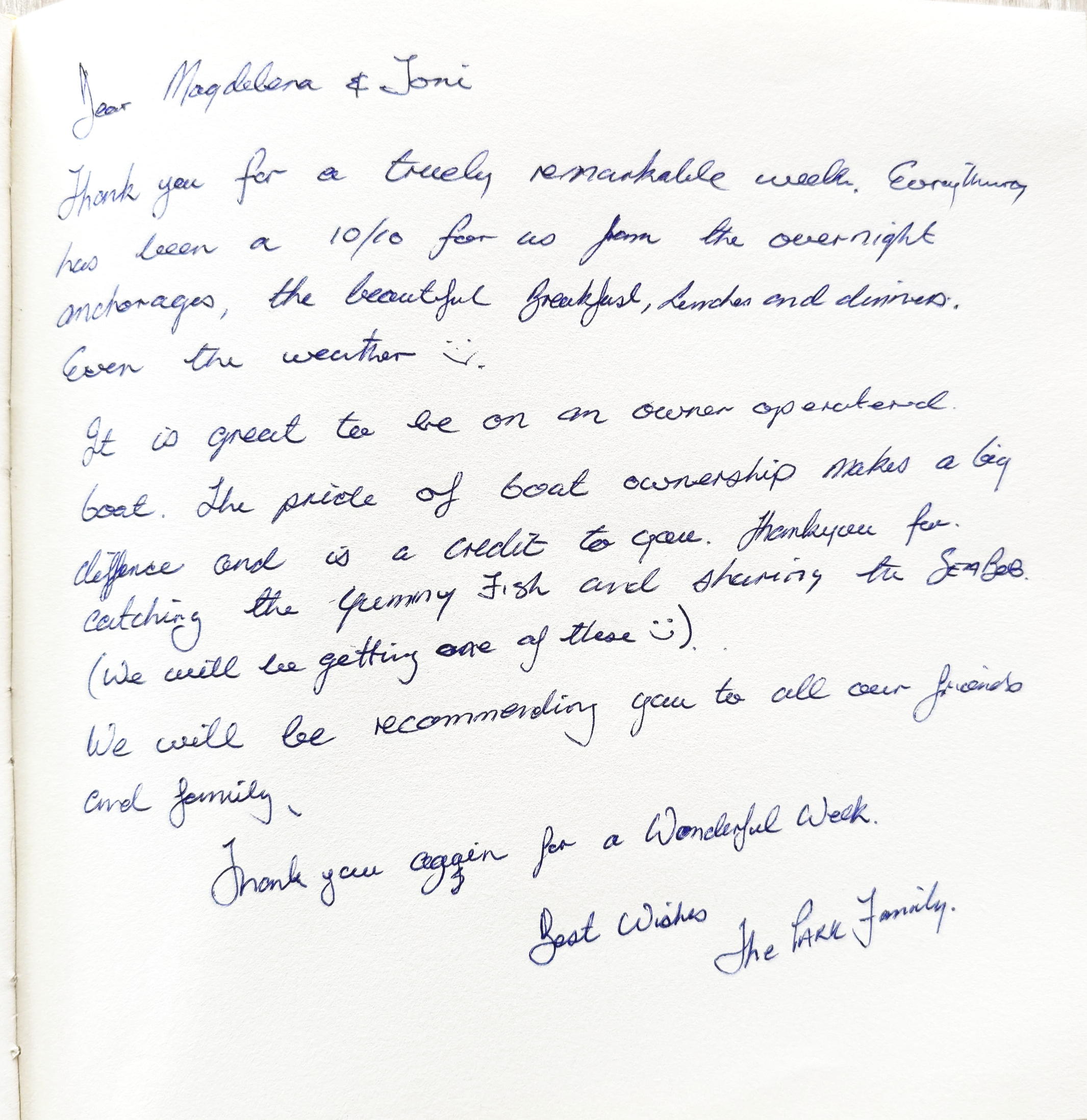 A handwritten letter on white paper with blue ink. The letter is addressed to Magdalen and Toni, expressing gratitude for a memorable week, mentions activities like anchorage, breakfast, lunches, and sharing fish. It discusses pride in boat ownership