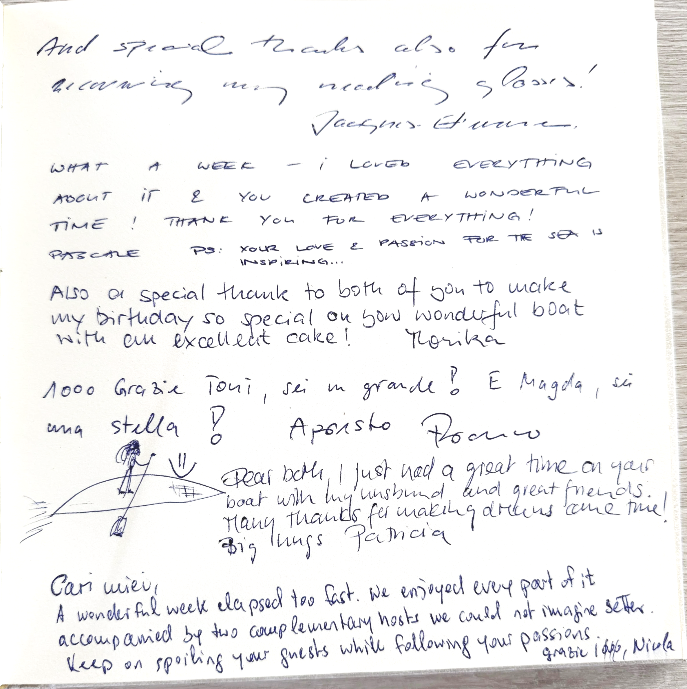 Handwritten thank you message on paper, expressing gratitude for an enjoyable week, mentioning a lovely boat and cake, with a sketch of a person on a boat.