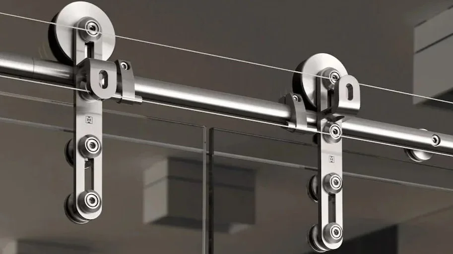 Close-up of a roller coaster track mounted on a gray ceiling.