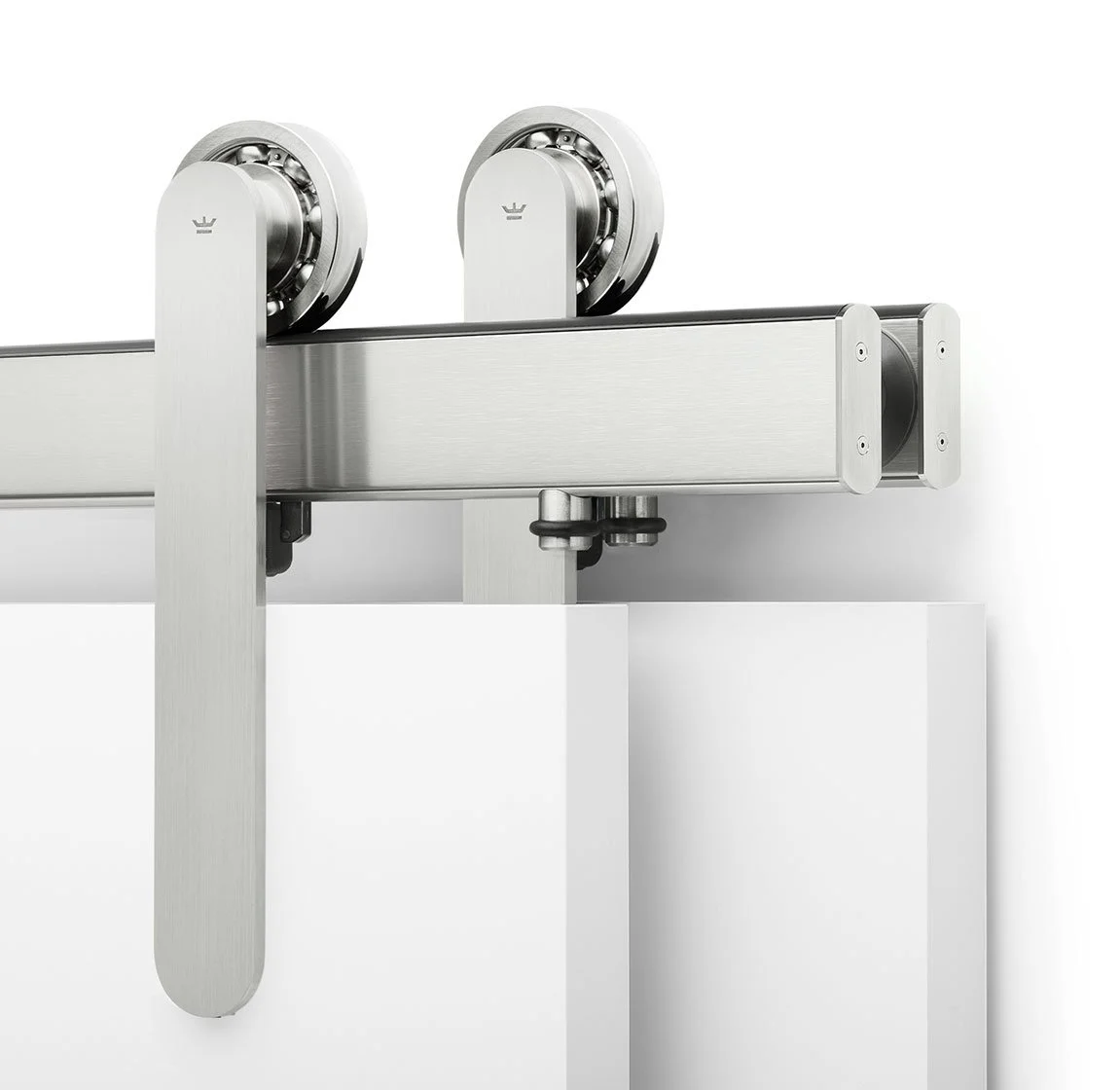Close-up of a metallic roller bearing attached to a modern, minimalist metal frame.