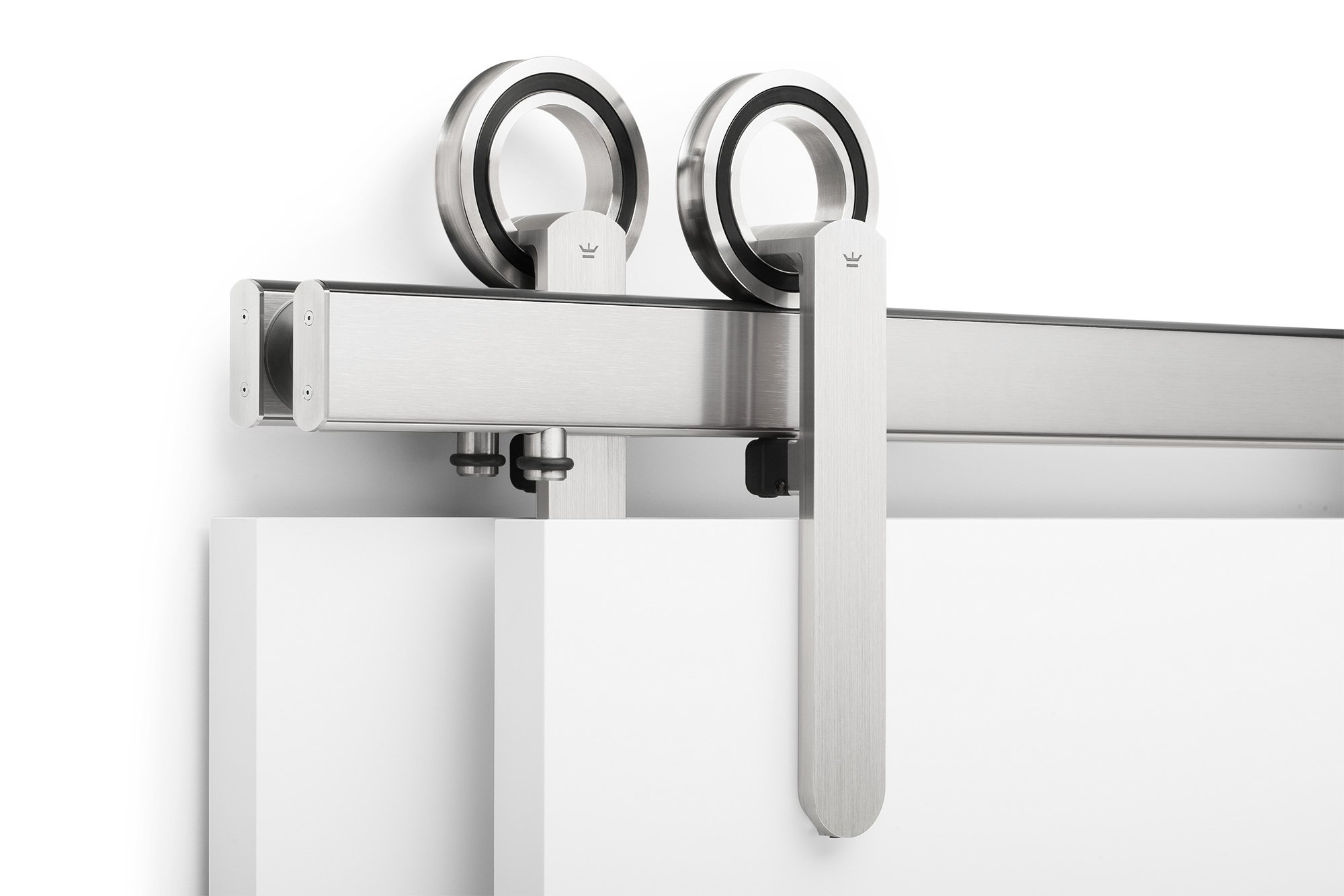 Close-up of a sliding door hardware with a roller and metal rail.