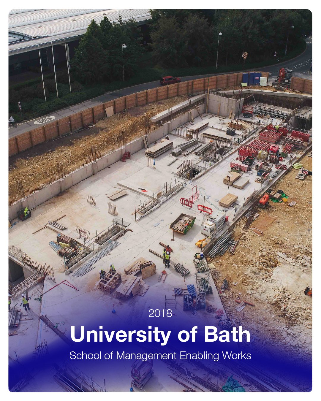 Construction site of a building with workers and materials, next to a sidewalk and greenery, at the University of Bath in 2018.