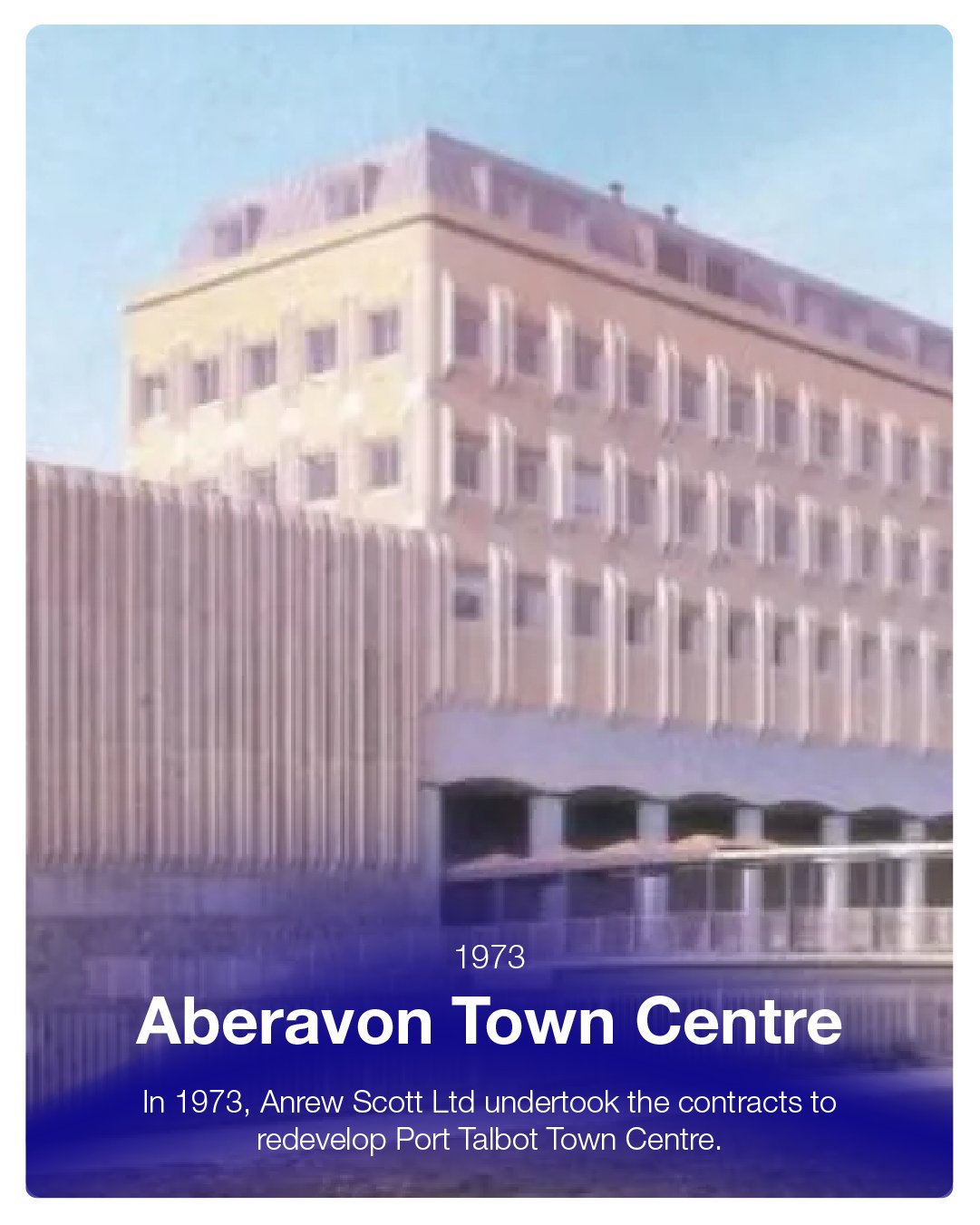 Photo of a beige multi-story building with a modern architectural style, labeled as Aberavon Town Centre from 1973, with a blue sky background and water reflection at the bottom.