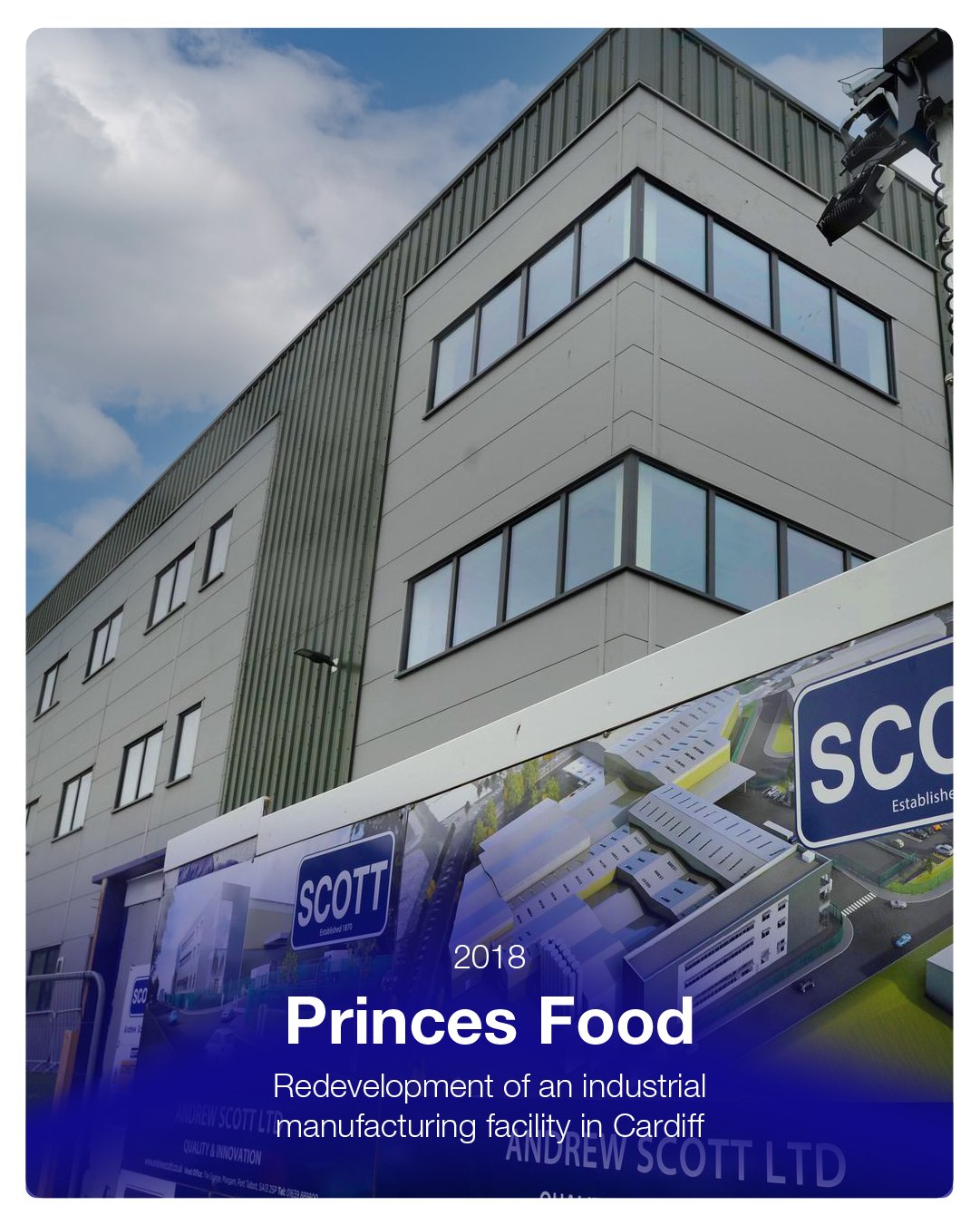 Photograph of a modern multi-story building with large windows and green metal siding, adjacent to a billboard displaying the logo of Andrew Scott Ltd and text about the redevelopment of an industrial manufacturing facility in Cardiff, dated 2018.