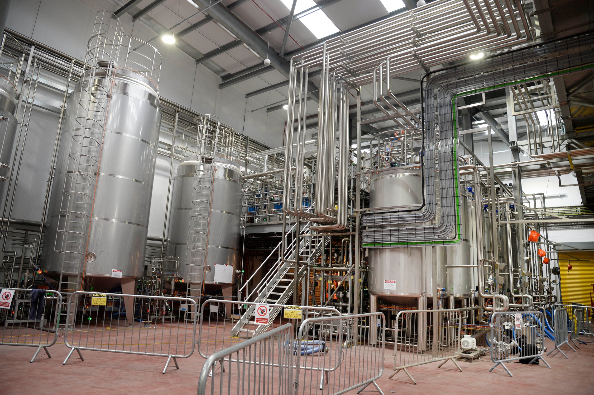 Industrial facility with large metal tanks and piping