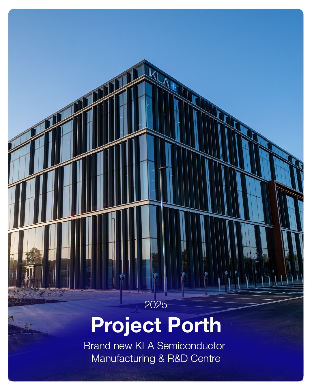 Modern glass building with vertical black beams and a sign reading 2025 Project Porth, a new KLA Semiconductor Manufacturing & R&D Centre