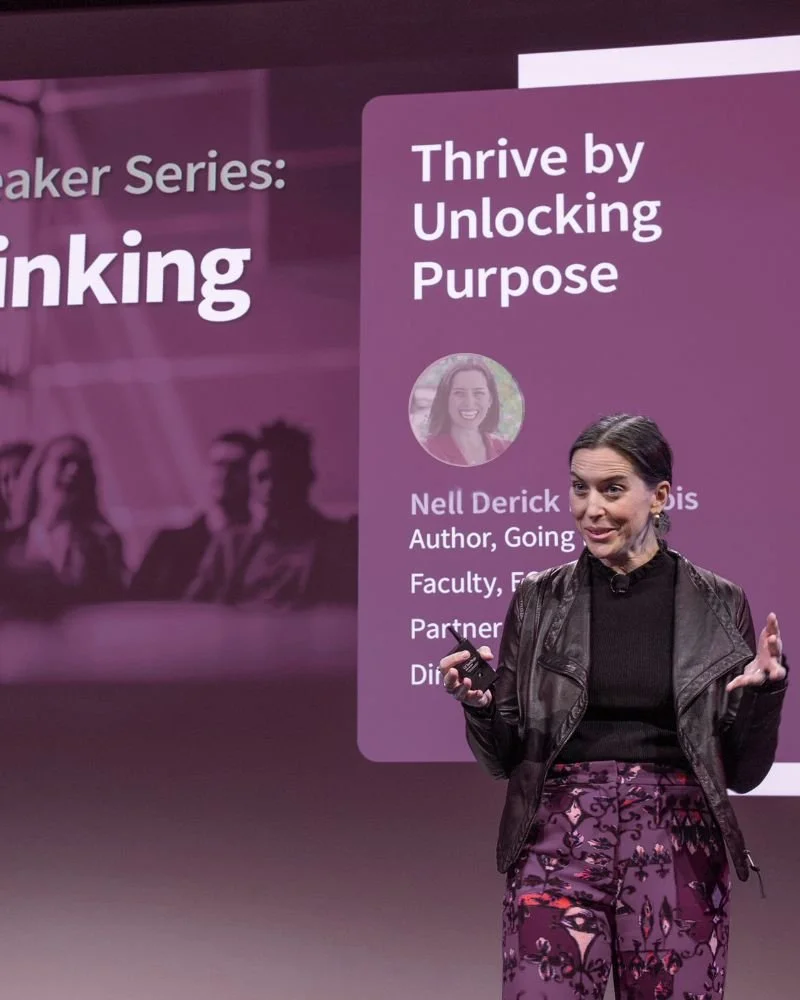 Nell Speaking on stage