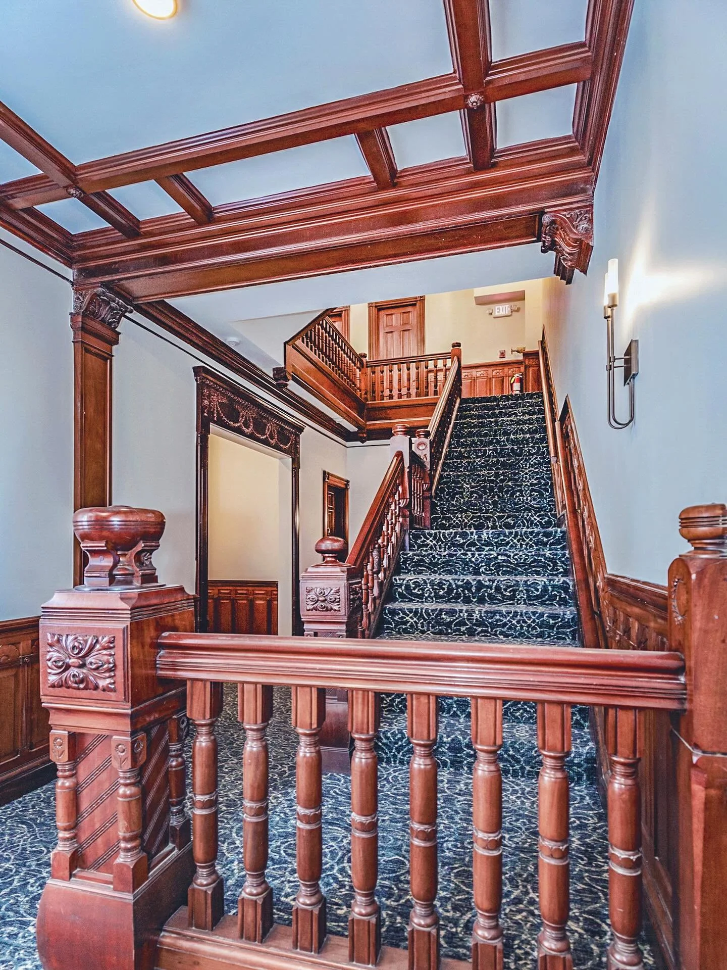 Most people rush through common area foyers and halls, never realizing these spaces can become the crown jewel of a building. With a blend of timeless woodwork, rich textures, and thoughtful lighting, a hall transforms into so much more than a corrid