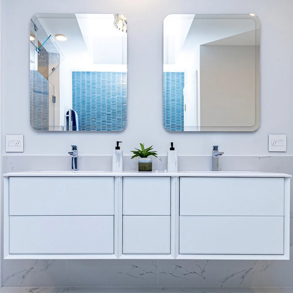 A well designed double vanity is more than a beautiful moment. It is a daily time saver that allows two routines to happen at once without compromise. Floating cabinetry keeps the space feeling open while the stone resin countertop with integrated si