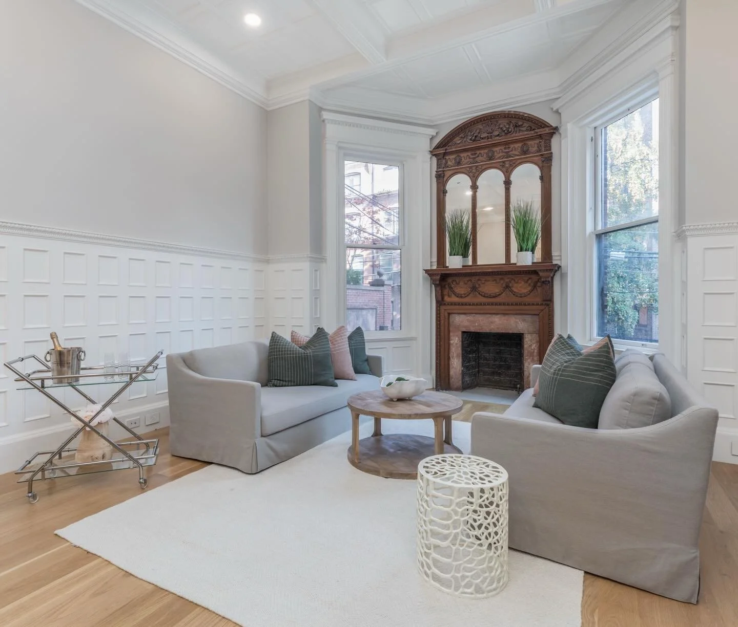 A quiet kind of luxury.

In this Boston sitting room, ornate original, but reimagined architecture sets the tone while a soft, restrained furnishing plan allows the details to speak. Clean lined seating, a light tonal palette, and thoughtful layering