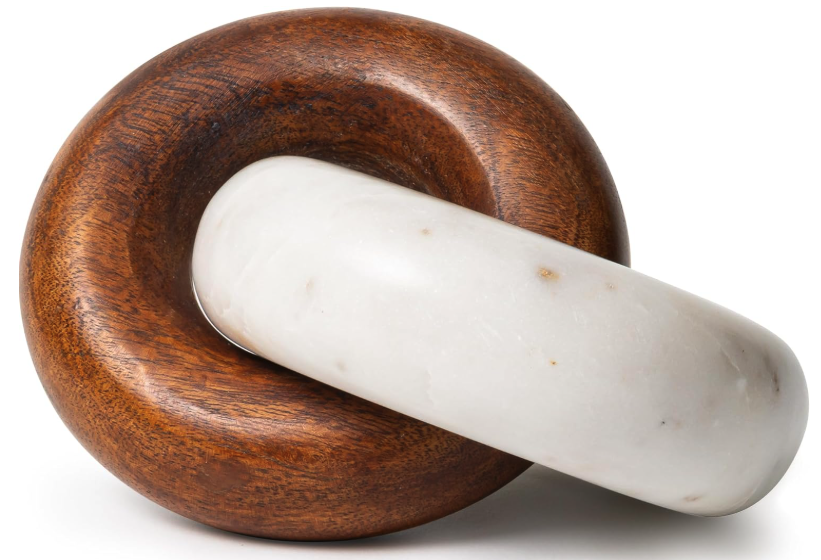 Marble & Wood Decorative Knot.

A timeless decorative accent that adds warmth, texture, and sculptural interest to coffee tables, bookshelves, and consoles. Its natural materials make it an effortless finishing touch for a beautifully layered home.