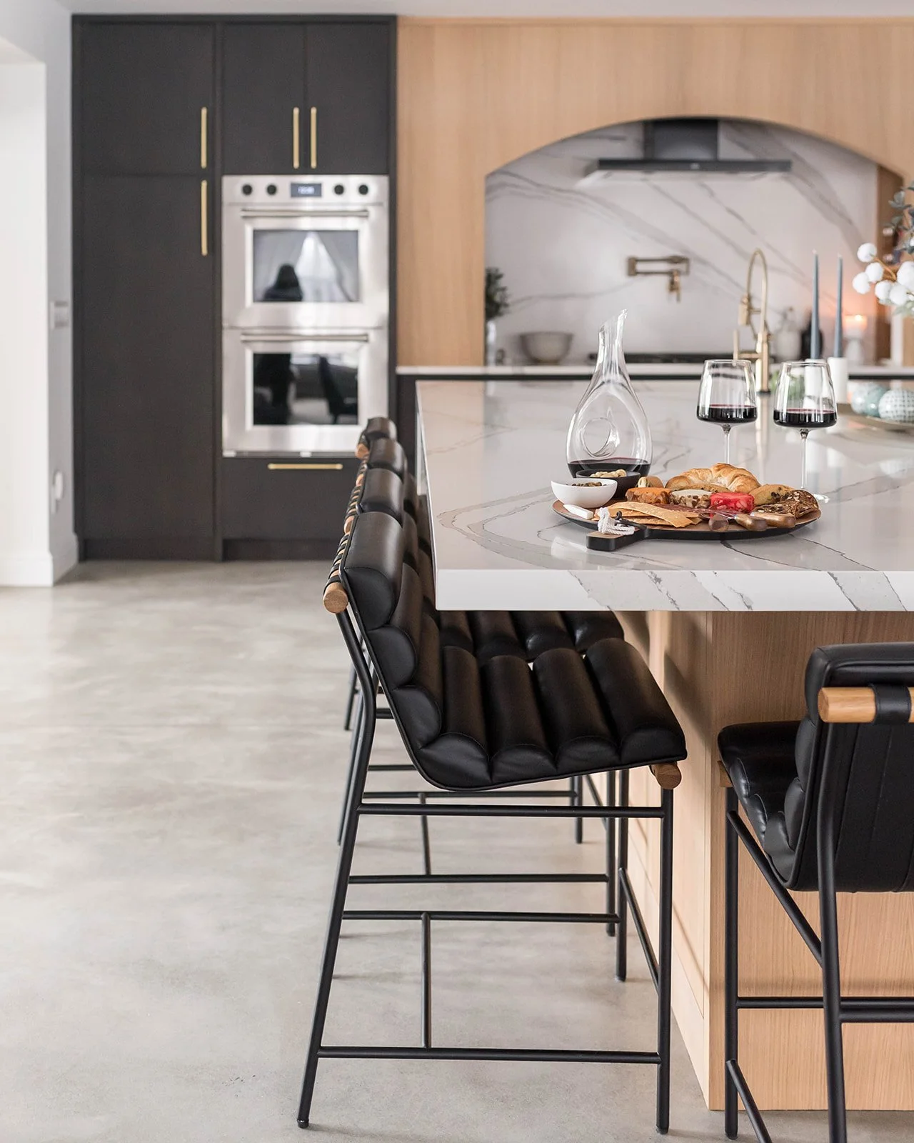 Fully remodeled kitchen featuring white oak cabinets, quartz countertops, and brass fixtures.