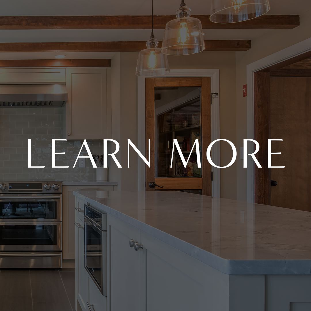 Modern kitchen with island, pendant lights, and text overlay 'Learn More'.