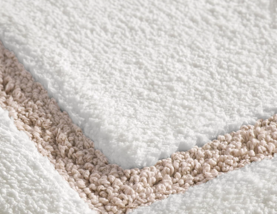 Border Tufted Bath Rug.

Add warmth and softness to your bathroom with this plush tufted bath rug. Its timeless border design and neutral tones create an elevated, spa-inspired look while providing comfort underfoot.