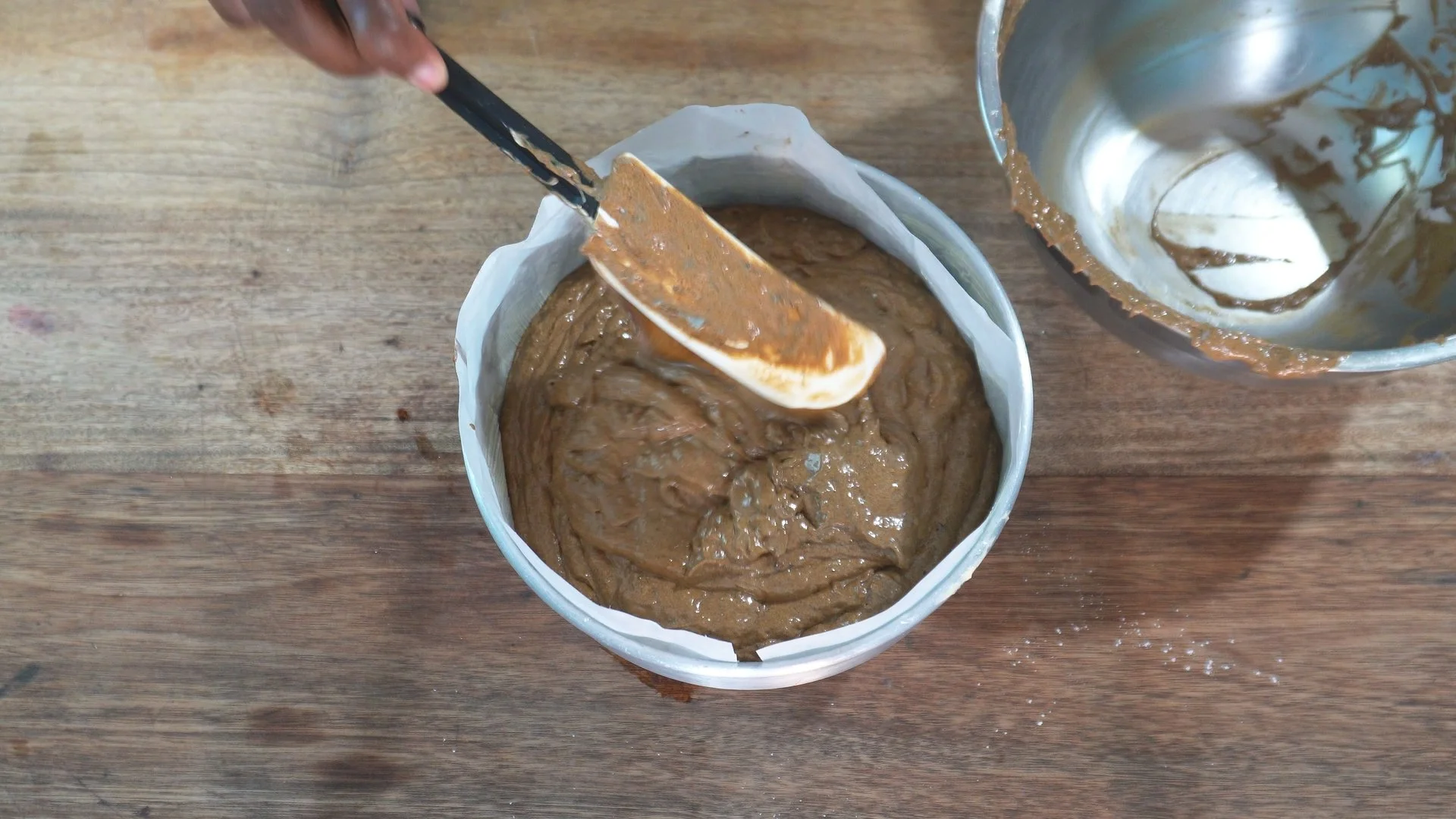 pouring fruit cake batter