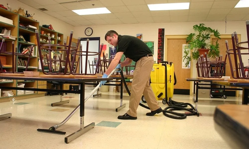 man cleaning at a school or church