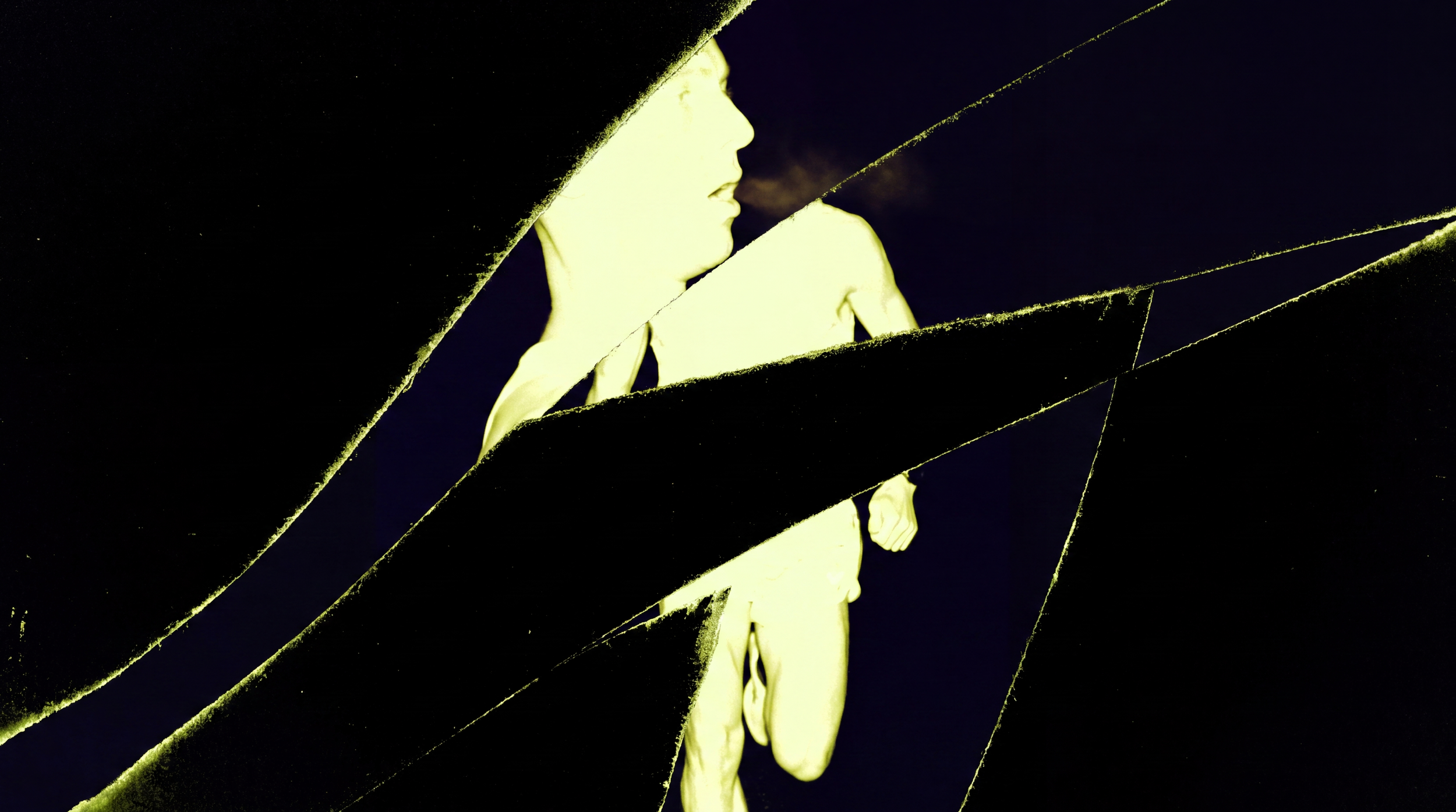 A broken mirror reflecting a woman in profile with blonde hair, wearing a white dress, against a dark background.