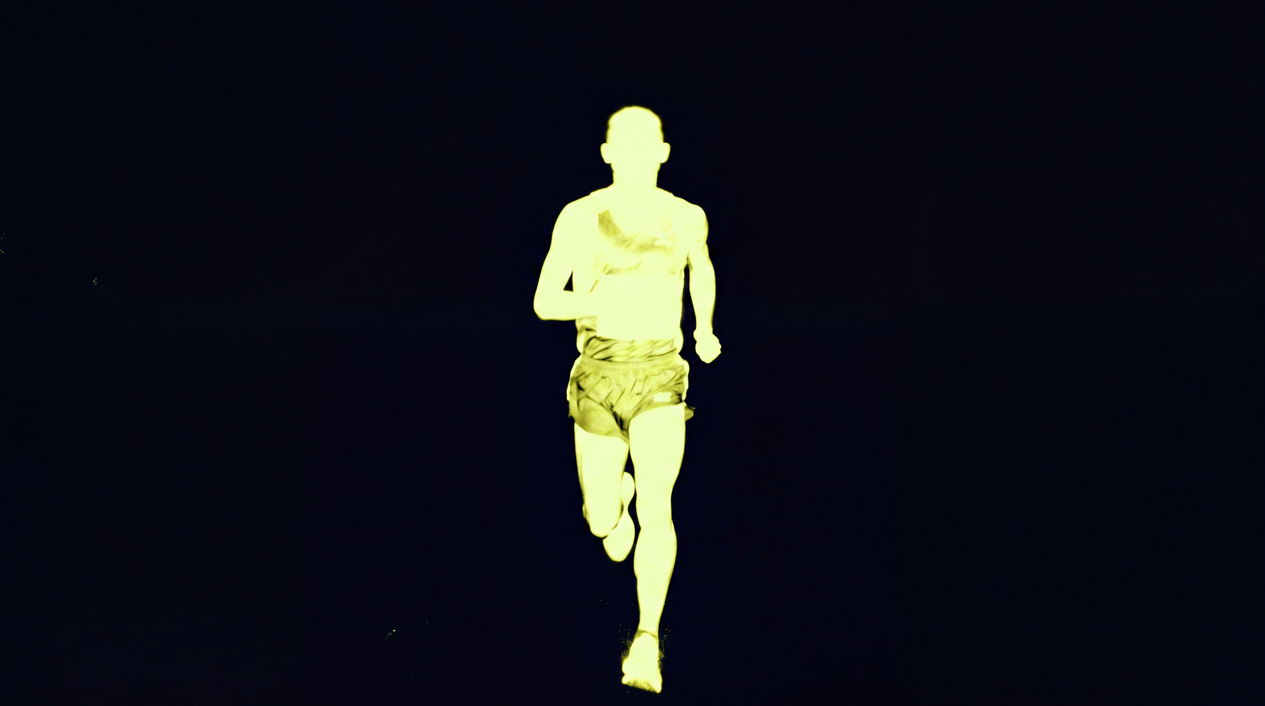 A glowing yellow silhouette of a man running against a dark background.
