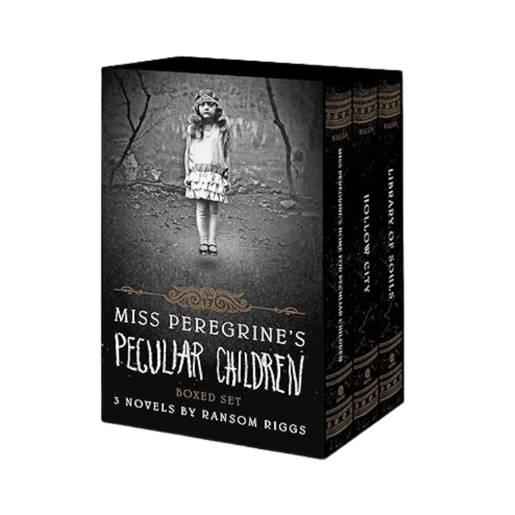 A boxed set of three novels titled 'Miss Peregrine's Peculiar Children' by Ransom Riggs, featuring a black and white cover with a young girl wearing a dress and a headband, standing on a path in a wooded area.