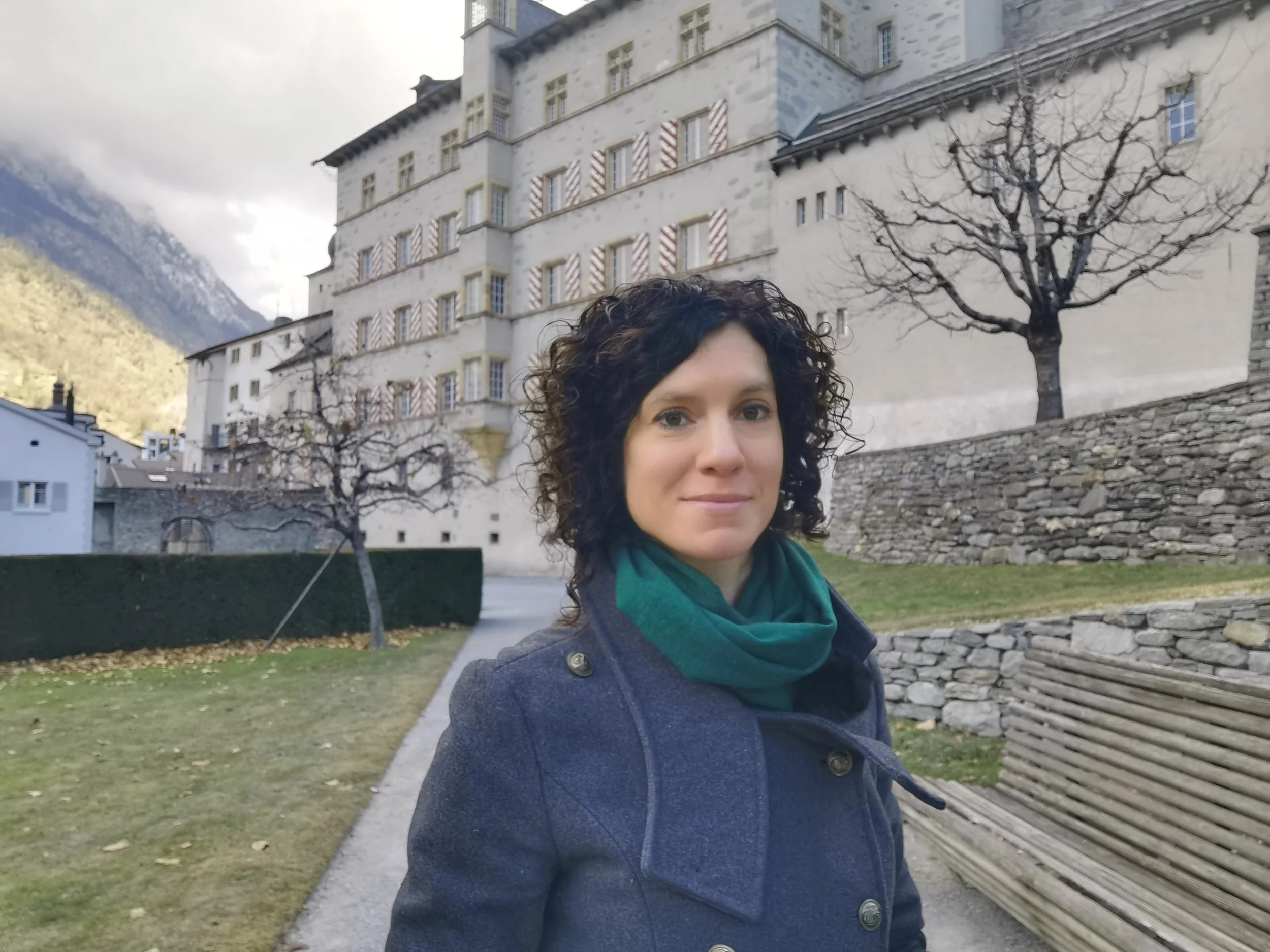 Melanie Shudofsky from Leadership Coaching Outdoors standing in a castle garden outside