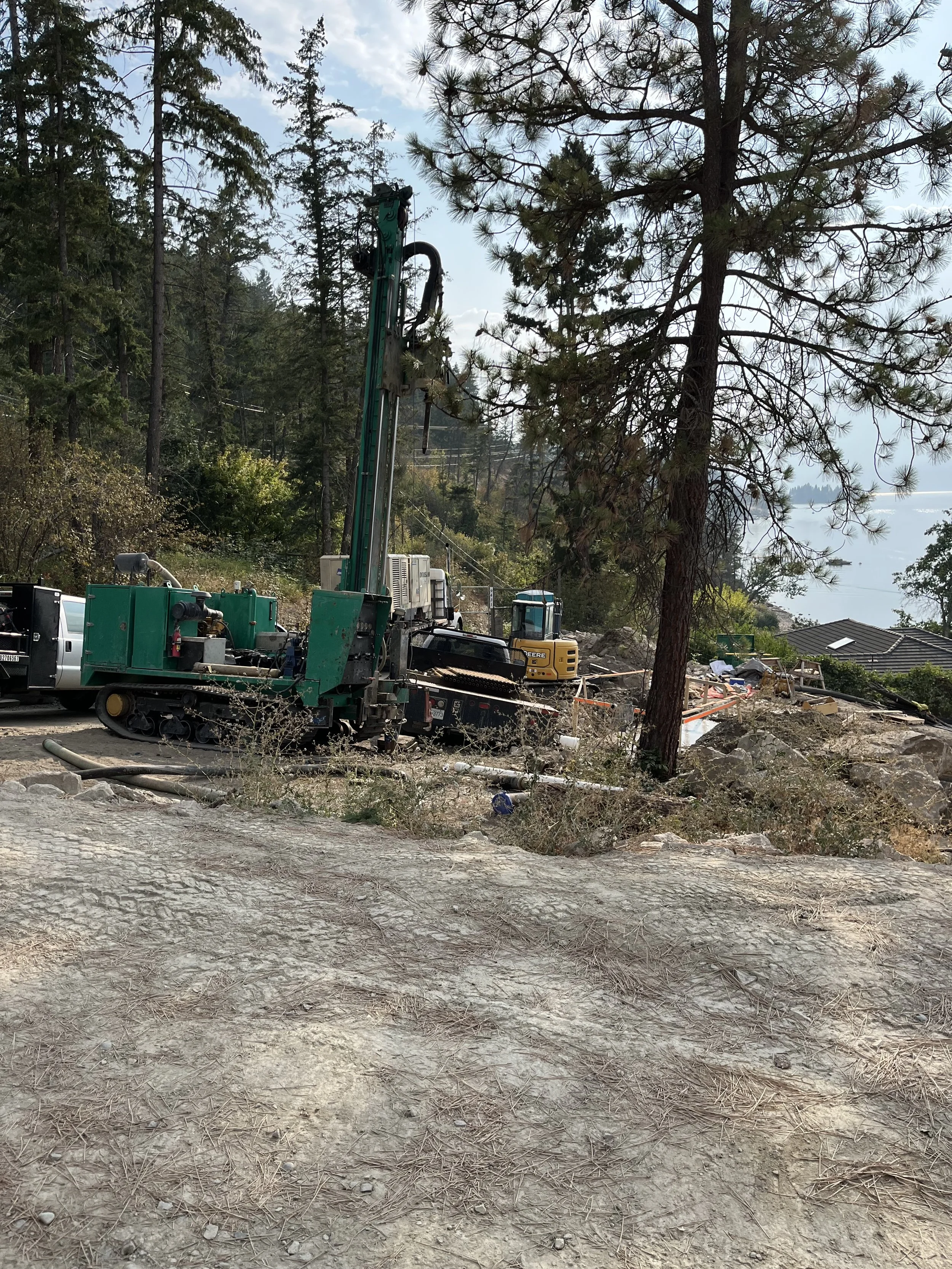 Water well drilling rig drilling water well in tight conditions and set back constraints.  Health Hazard Regulations. Interior Health Association