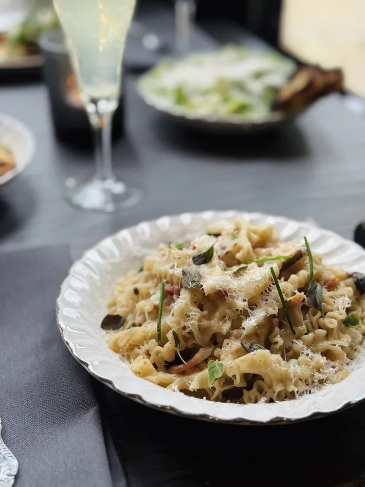 Pasta dish and bubbles from Stelline