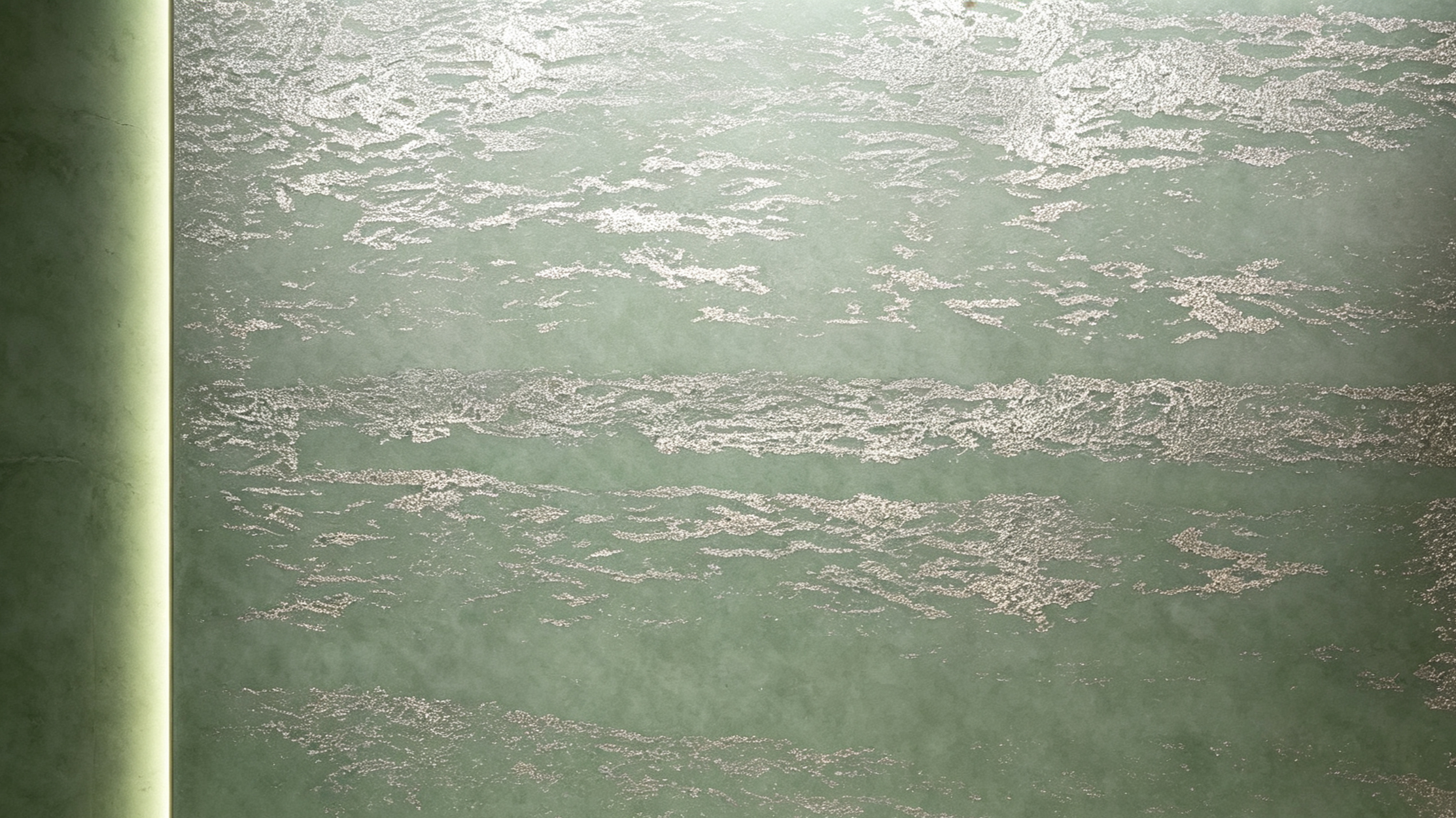 Close-up of a textured, greenish wall with horizontal streaks and a green vertical edge on the left side.