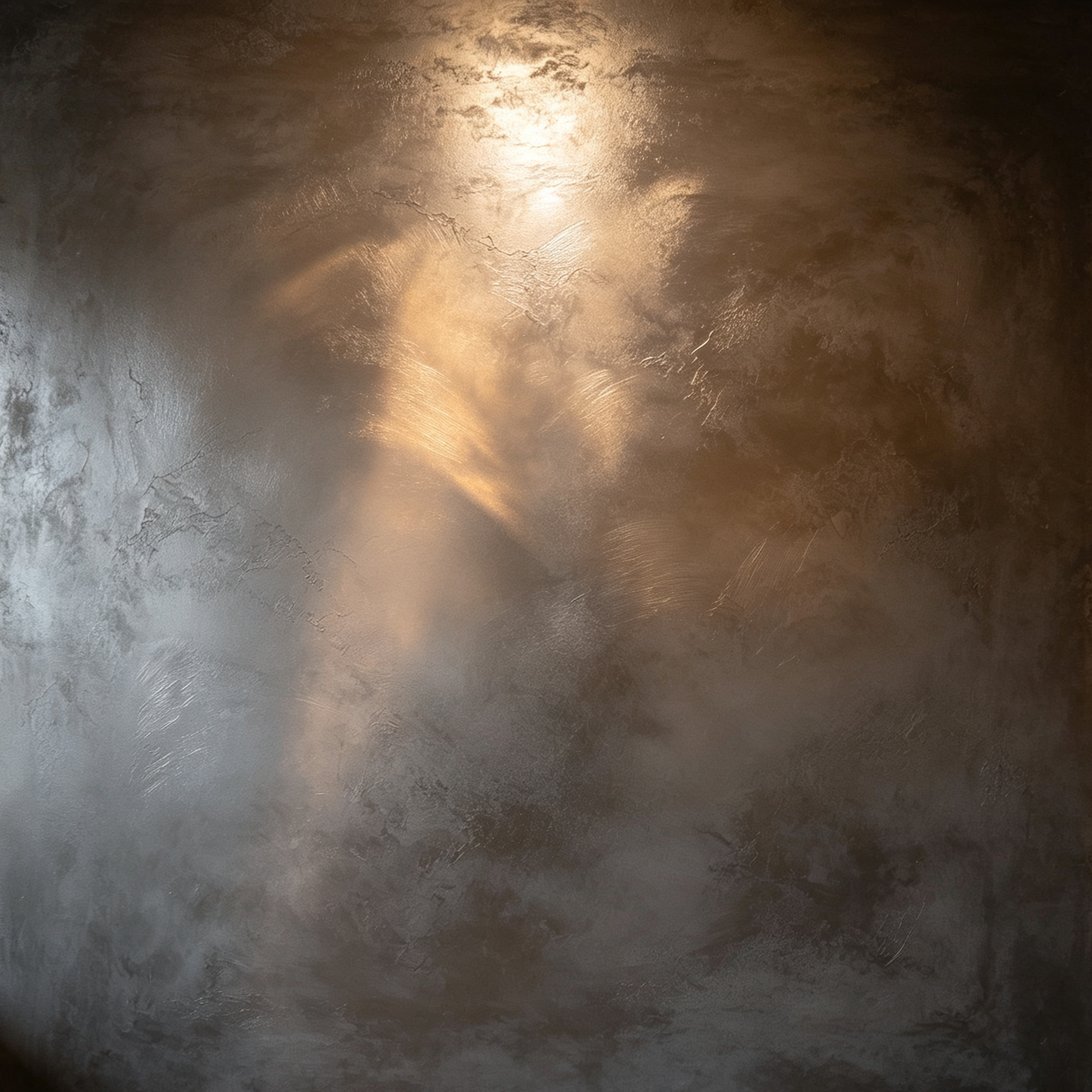 Close-up of a dark metallic surface with light reflections and subtle weathering or textures.