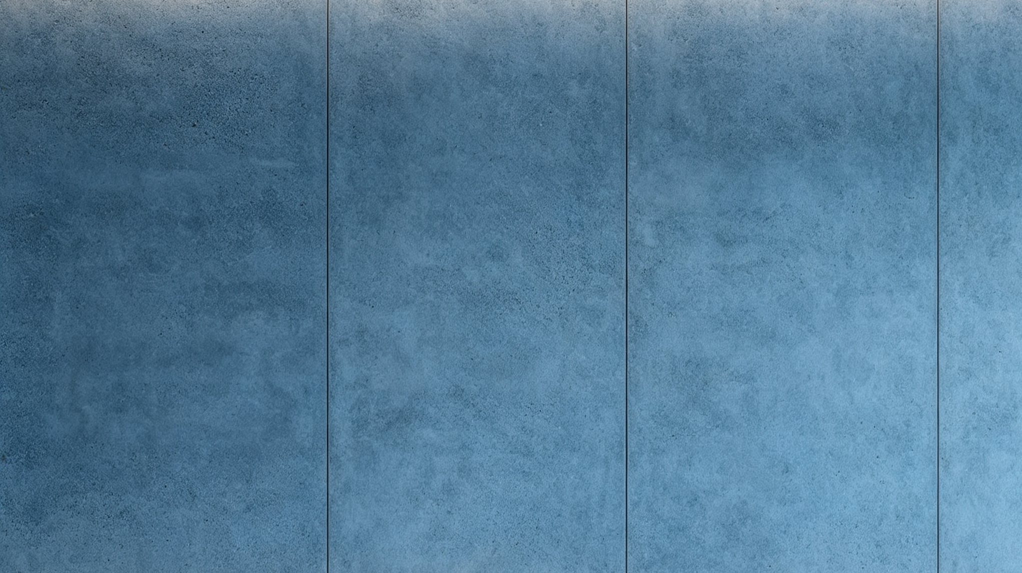 Close-up of blue textured tiles on a wall or floor.