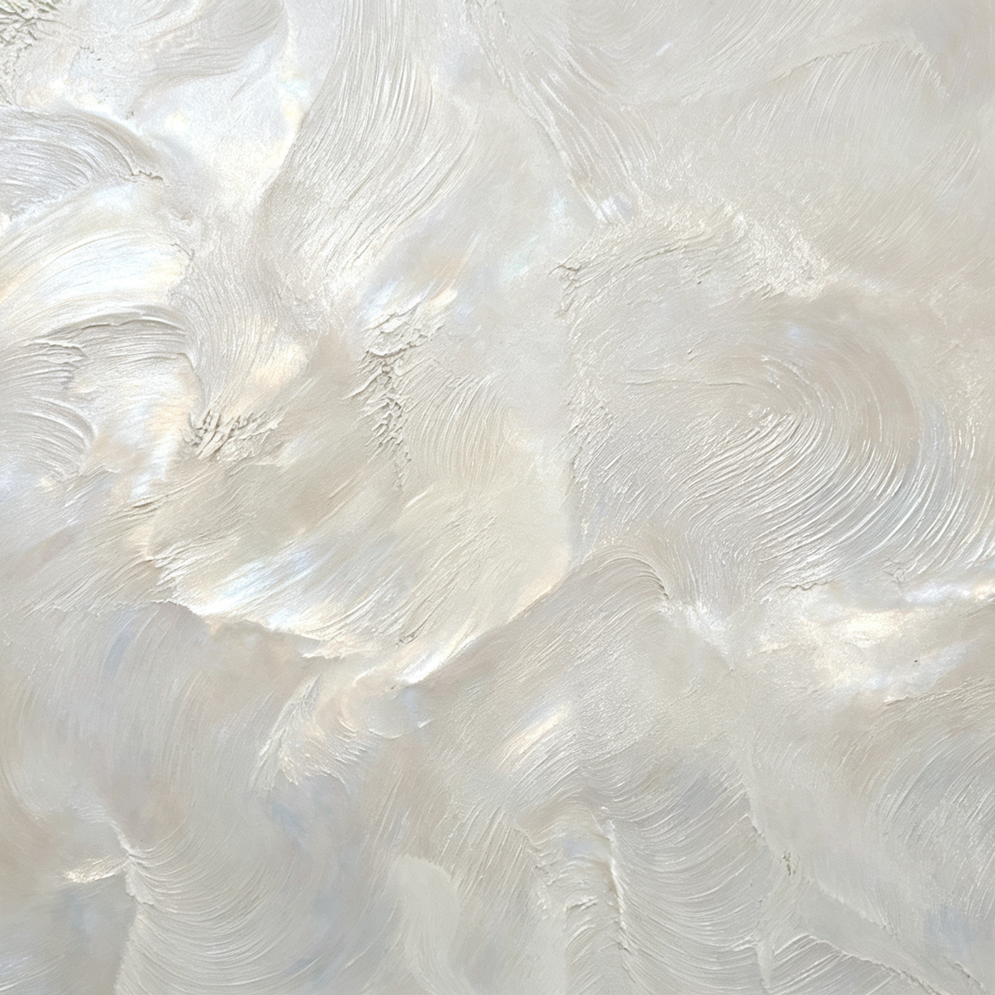 Close-up of a textured, swirled surface, likely paint or plaster, in light, off-white tones with iridescent highlights.
