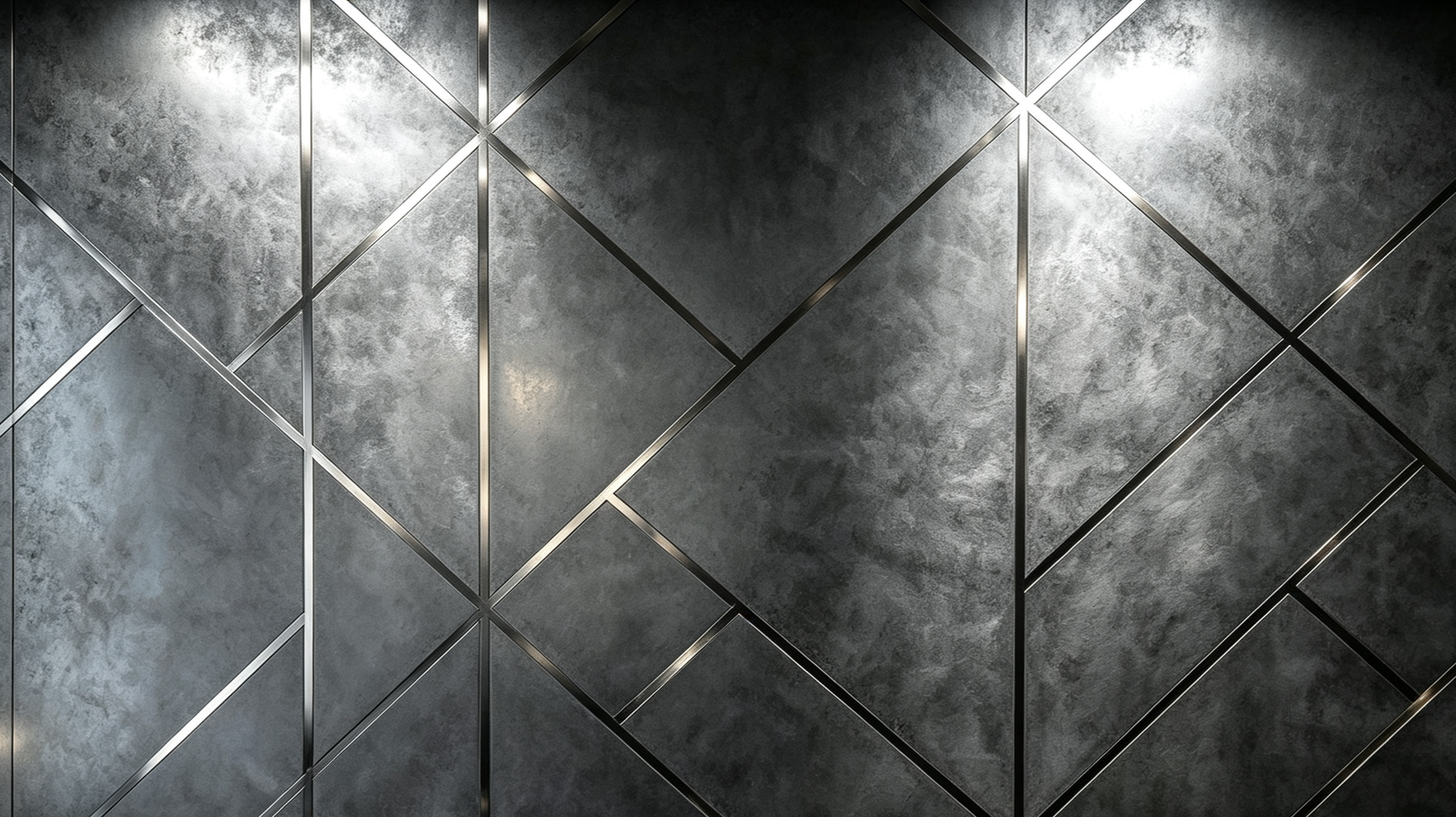 Close-up view of a metallic wall with diamond patterns created by raised metal strips, featuring a textured dark gray background.