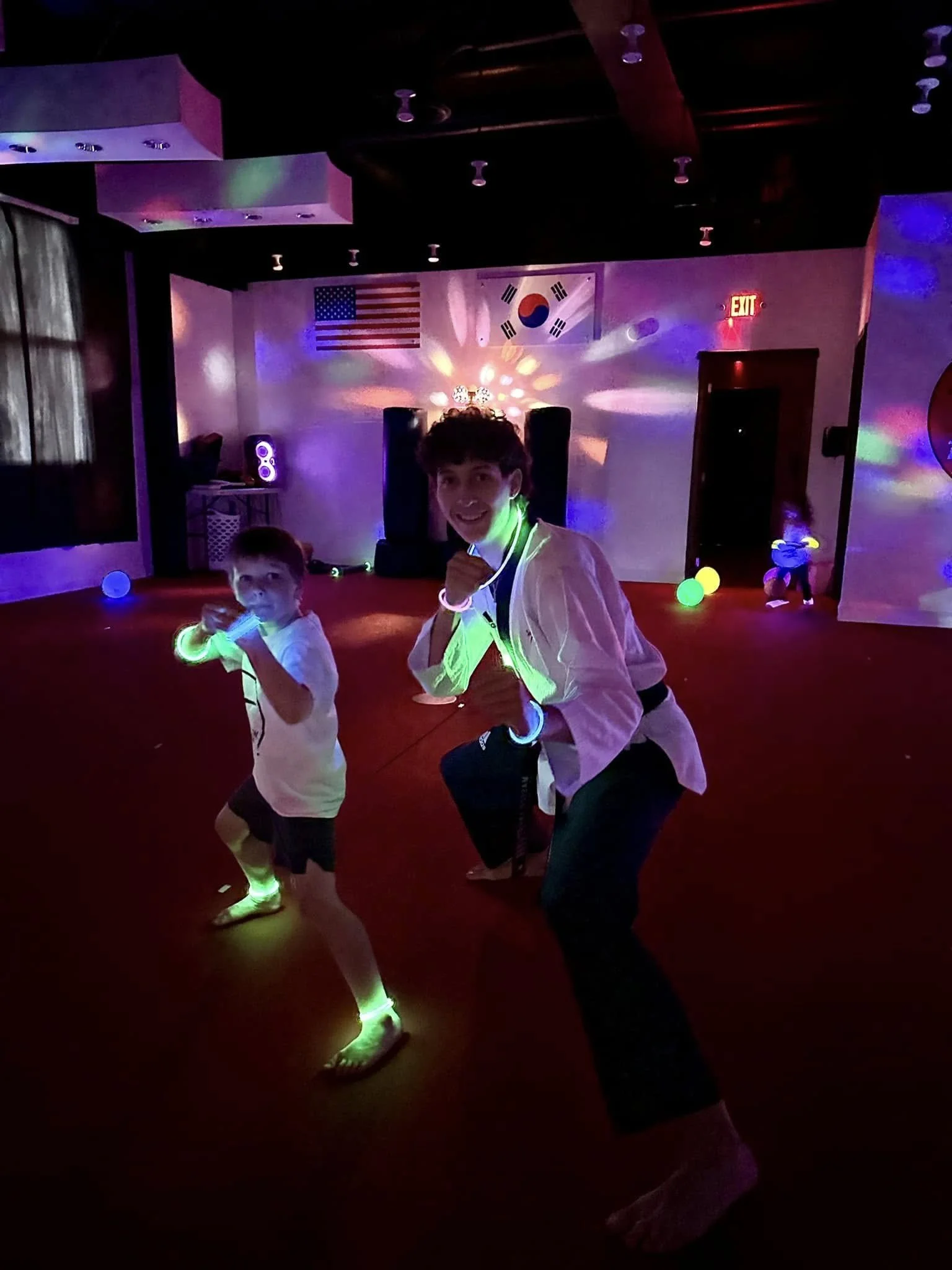 Child with teacher at Charleston Taekwondo's Parent's Night Out.