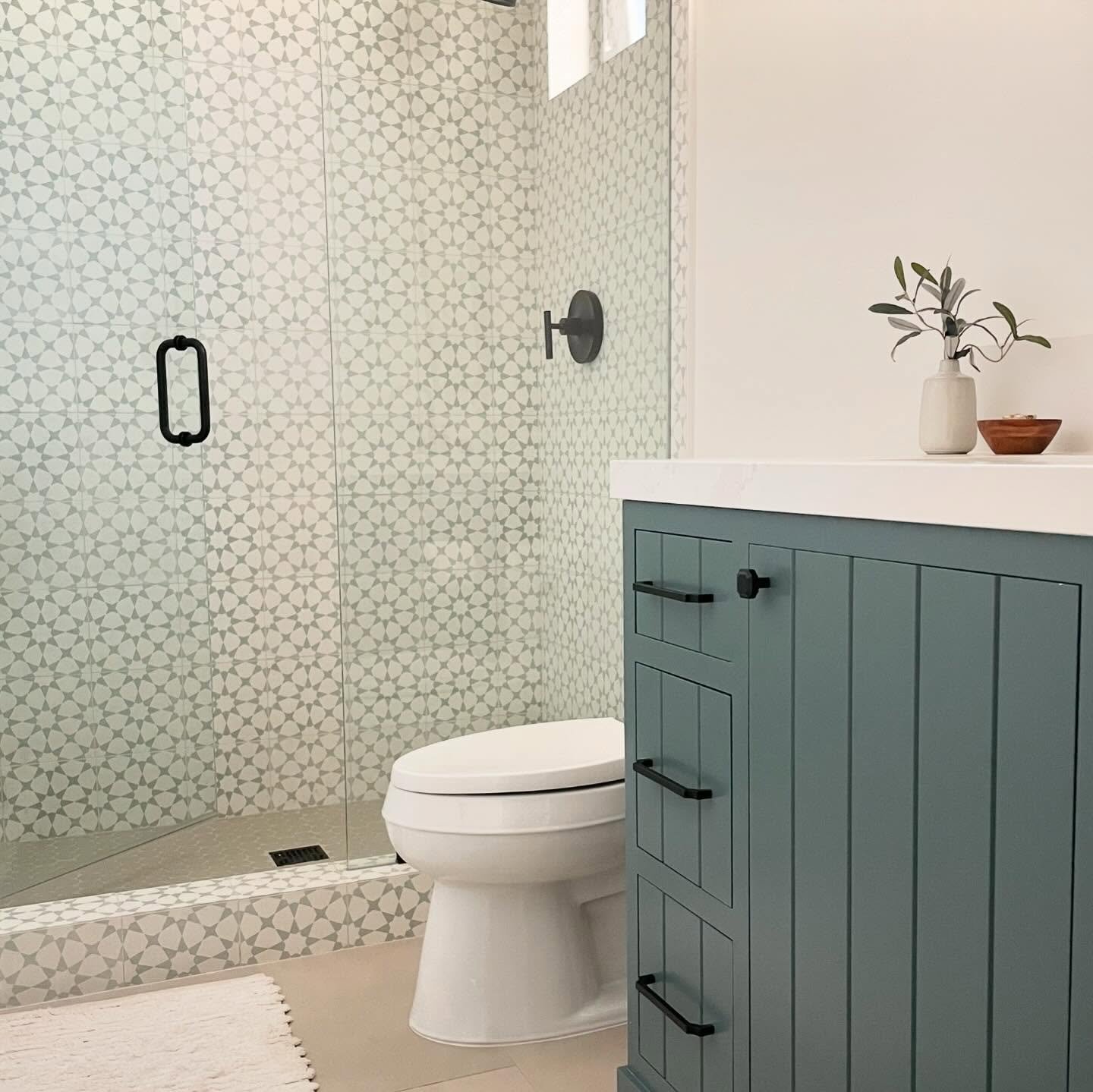 We love a pattern statement tile with a bold color to match.  With a custom in-set cabinet doors and a toe-kick detail the vanity could just steal the show.