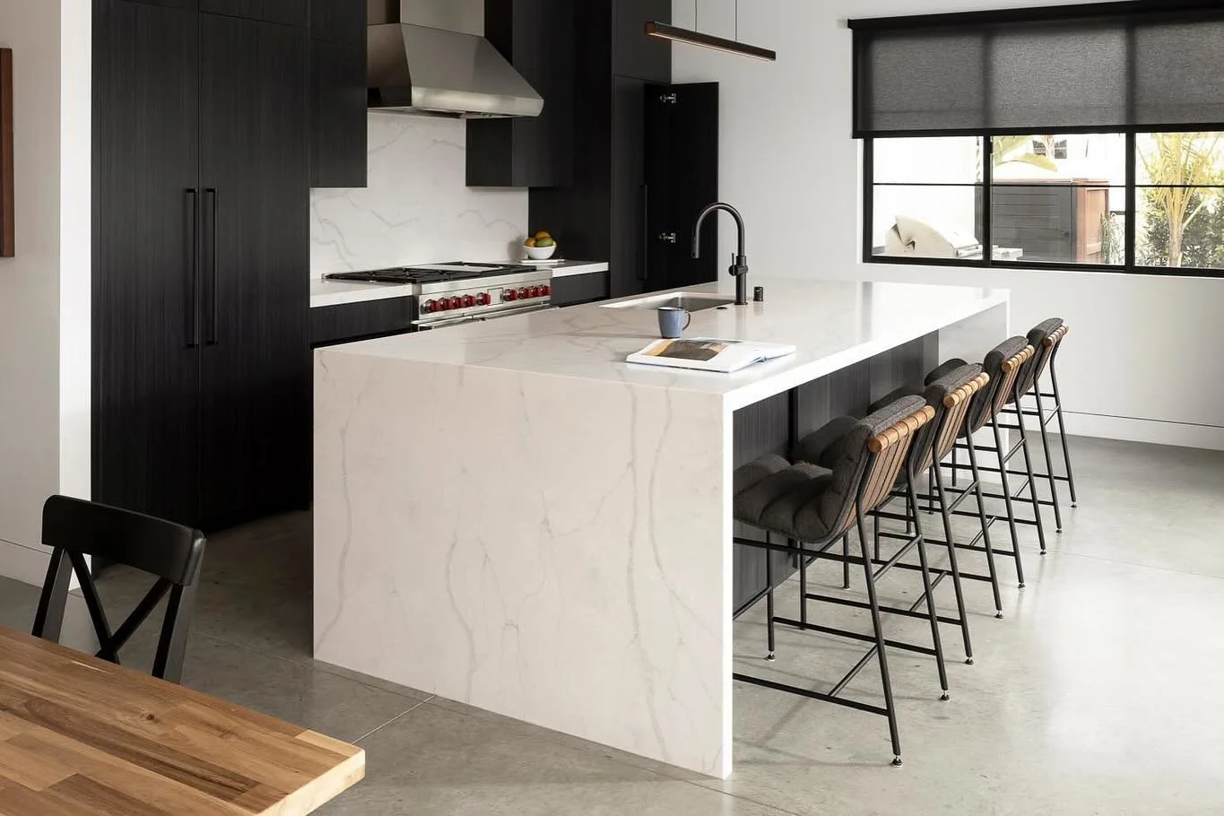 What do you do when have a beautiful waterfall edged countertop, but you need an outlet on both sides? You&rsquo;ve got a few options! For this one we put a black decorator plate cover over the microwave, function with style.  Did you spot the outlet