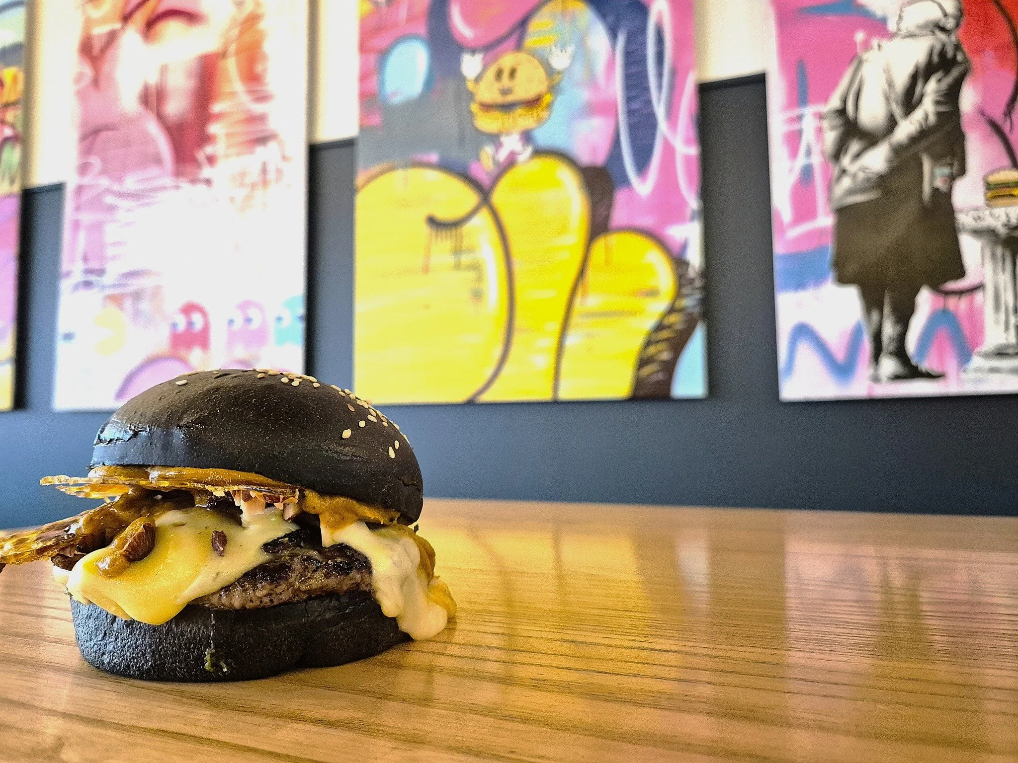 “Whoa, Black Betty (bam-ba-lam)!” 
@cultureburgerjoint is smokin’!.
140g beef patty, molten brie, spiced pumpkin, roasted almond & bacon brittle, chimichurri, all wrapped in a charcoal brioche bun that’s as dark as your p