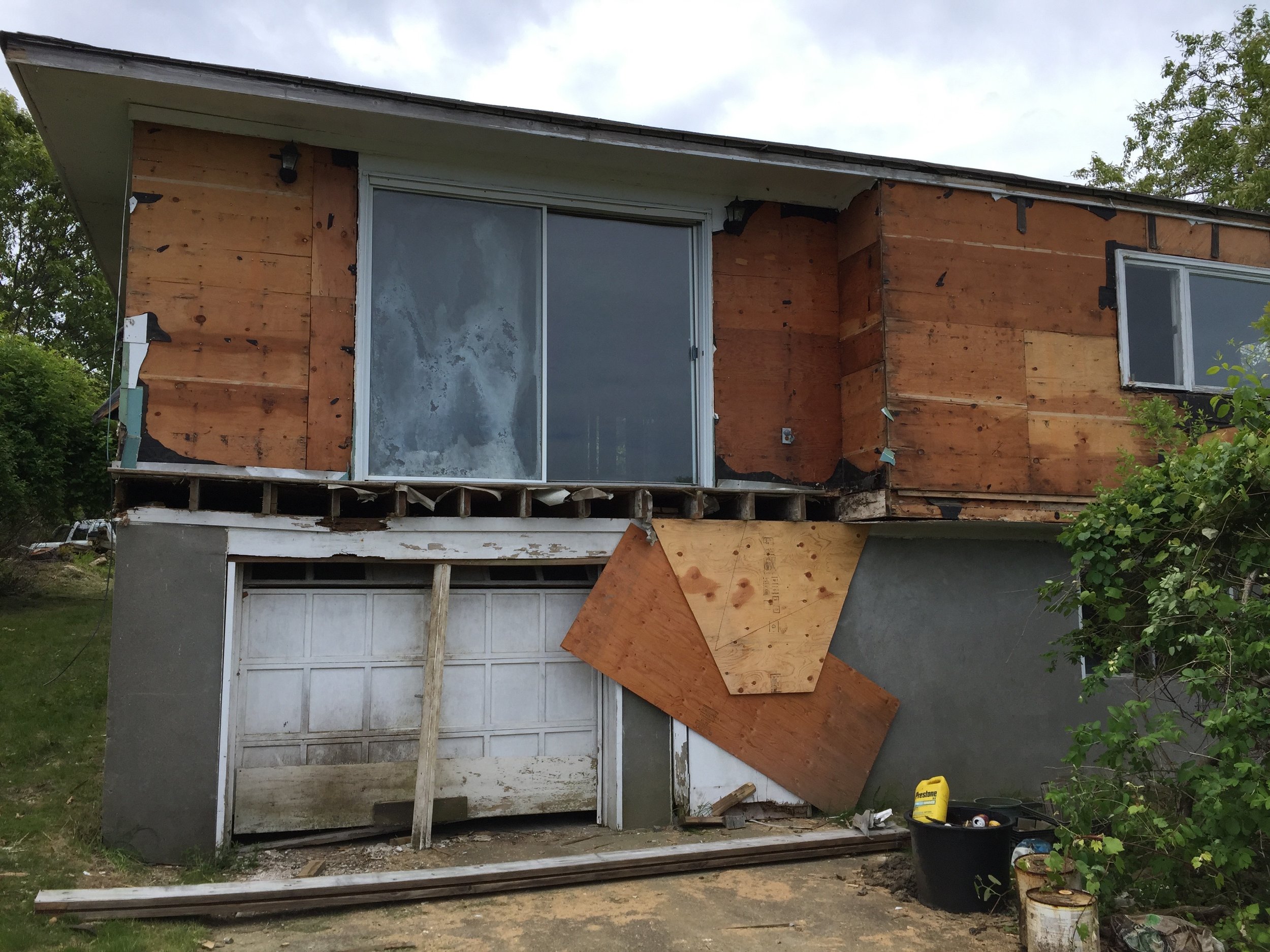 Before: waterside garage to become family room