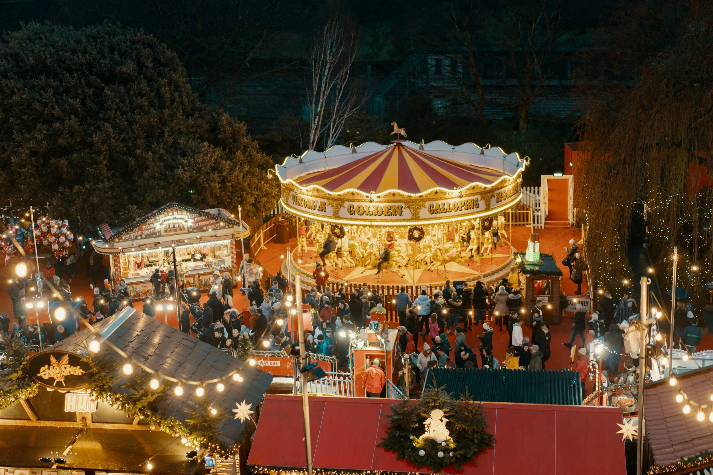 Christmas stalls and Edinburgh Castle backdrop at Edinburgh Christmas Market, Scotland