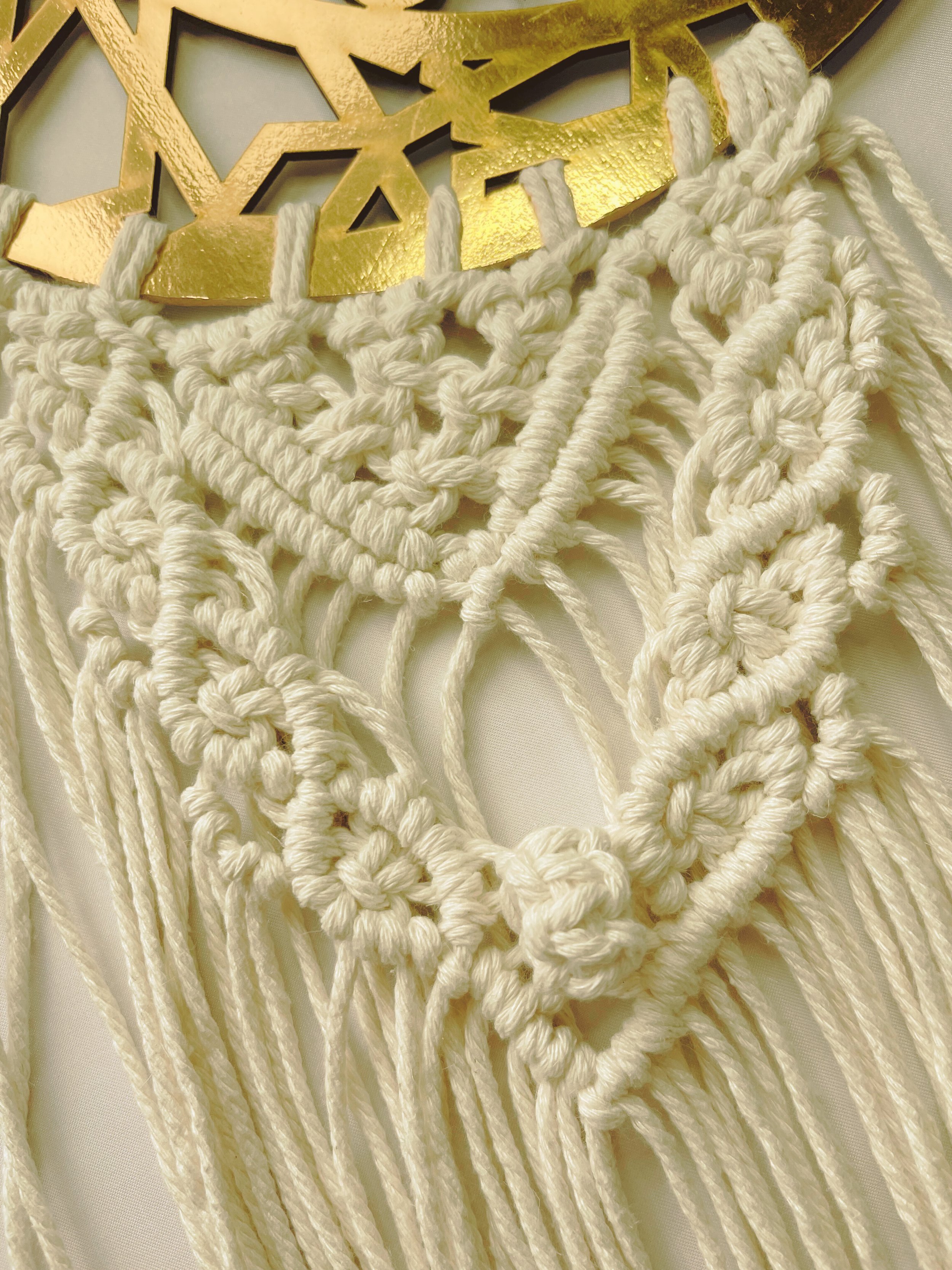 Close-up of handcrafted Islamic macramé wall hanging featuring detailed cotton knots and a gold crescent ayah plate – Samra Knots