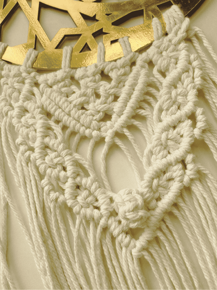 Close-up of handcrafted Islamic macramé wall hanging featuring detailed cotton knots and a gold crescent ayah plate – Samra Knots