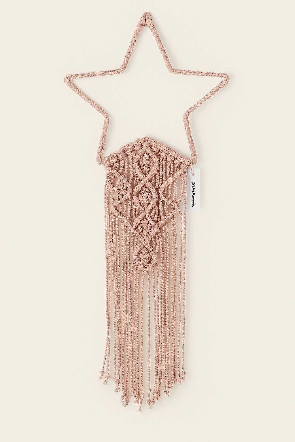 Blush pink macramé star wall hanging with intricate boho knots and fringe – handmade by Samra Knots.