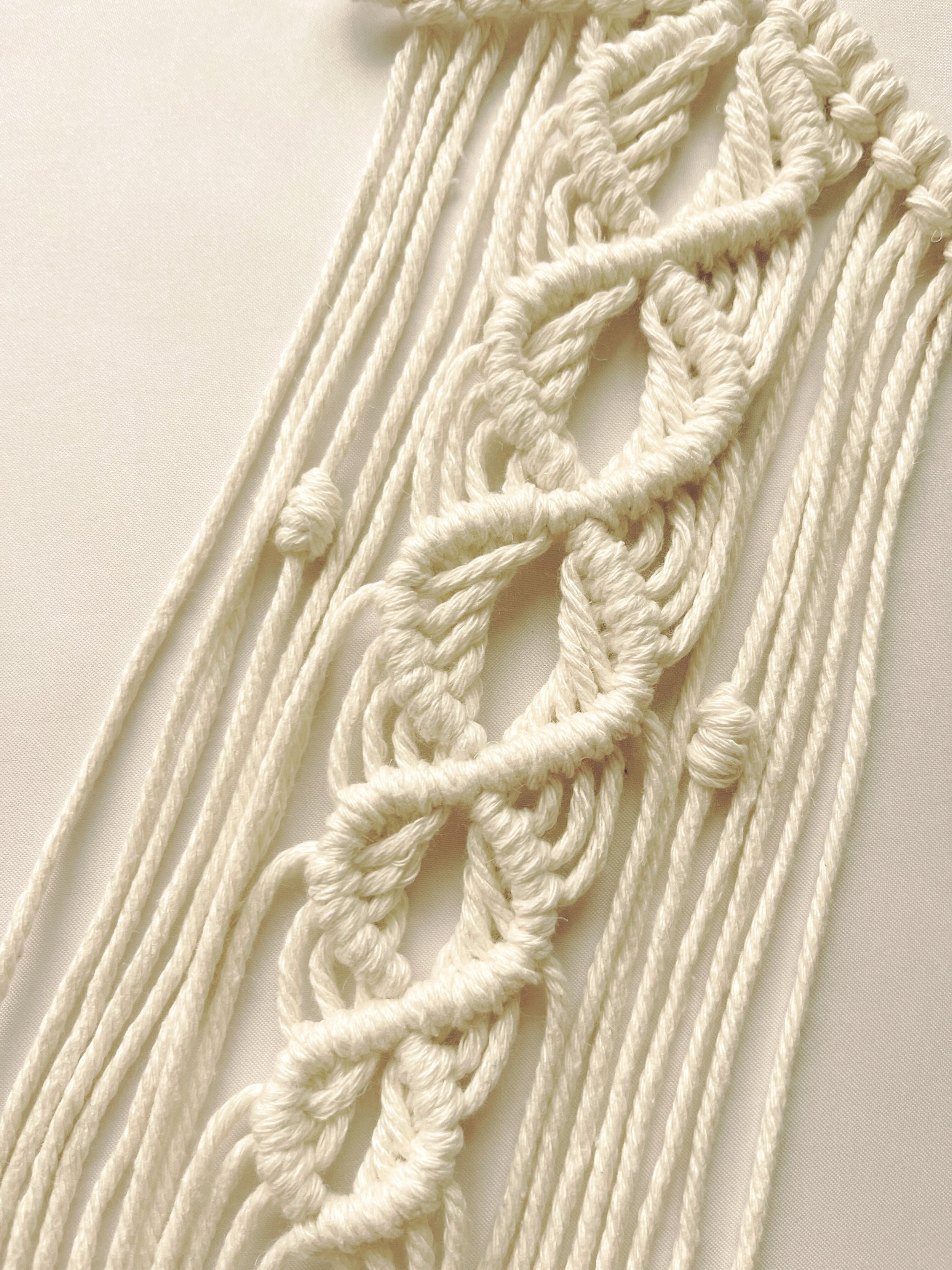 Close-up of handmade macramé star wall hanging with detailed knotting in off-white cotton cord – boho decor by Samra Knots