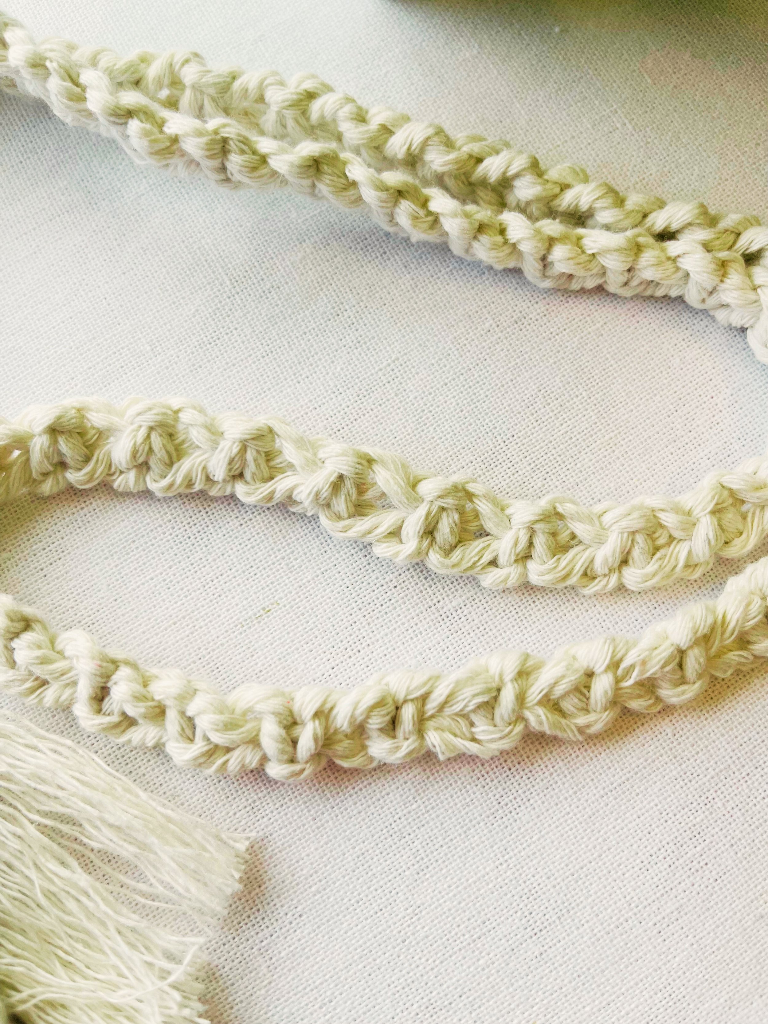 Close-up of handmade macramé strap – twisted cotton cord for phone bag or mini purse