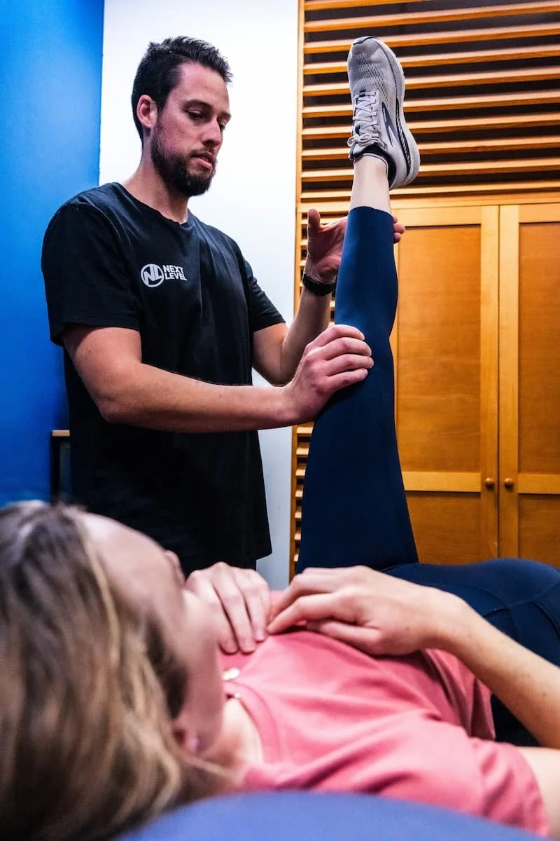 Physiotherapist conducting a detailed movement assessment during a 60-minute physiotherapy appointment in Varsity Lakes